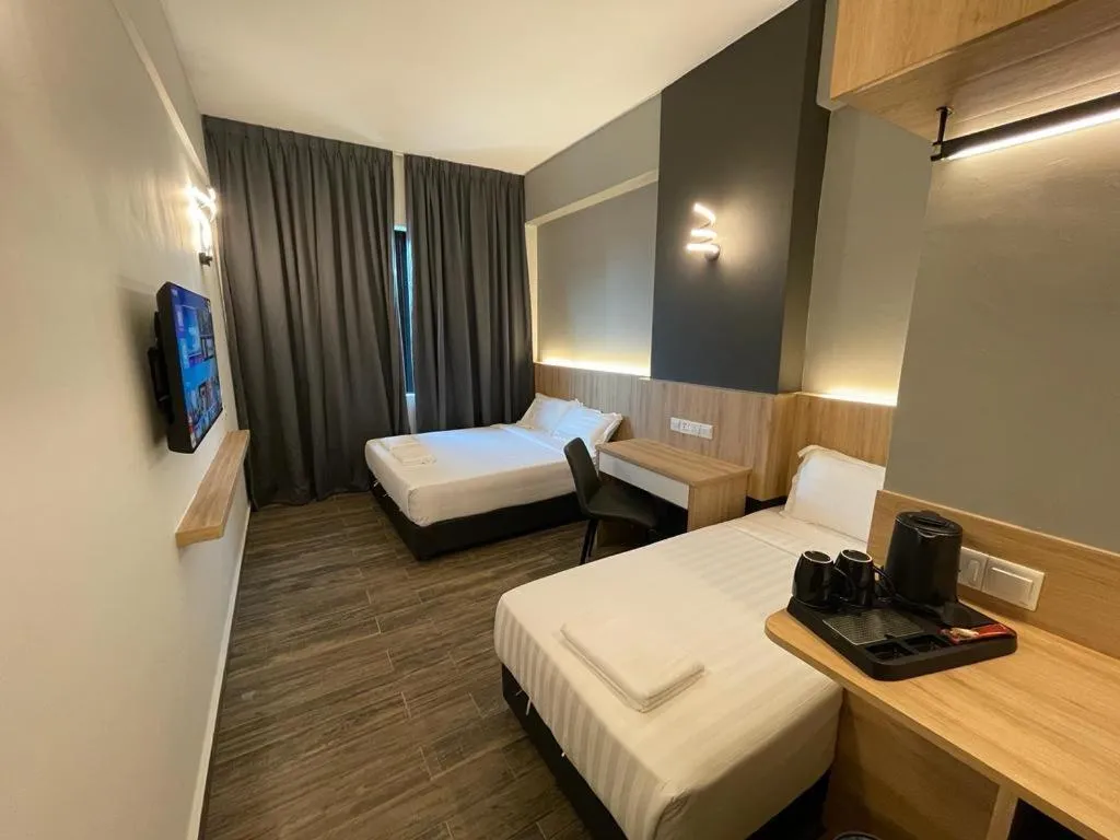 Bed in DJ Citi Plaza Hotel & Suites