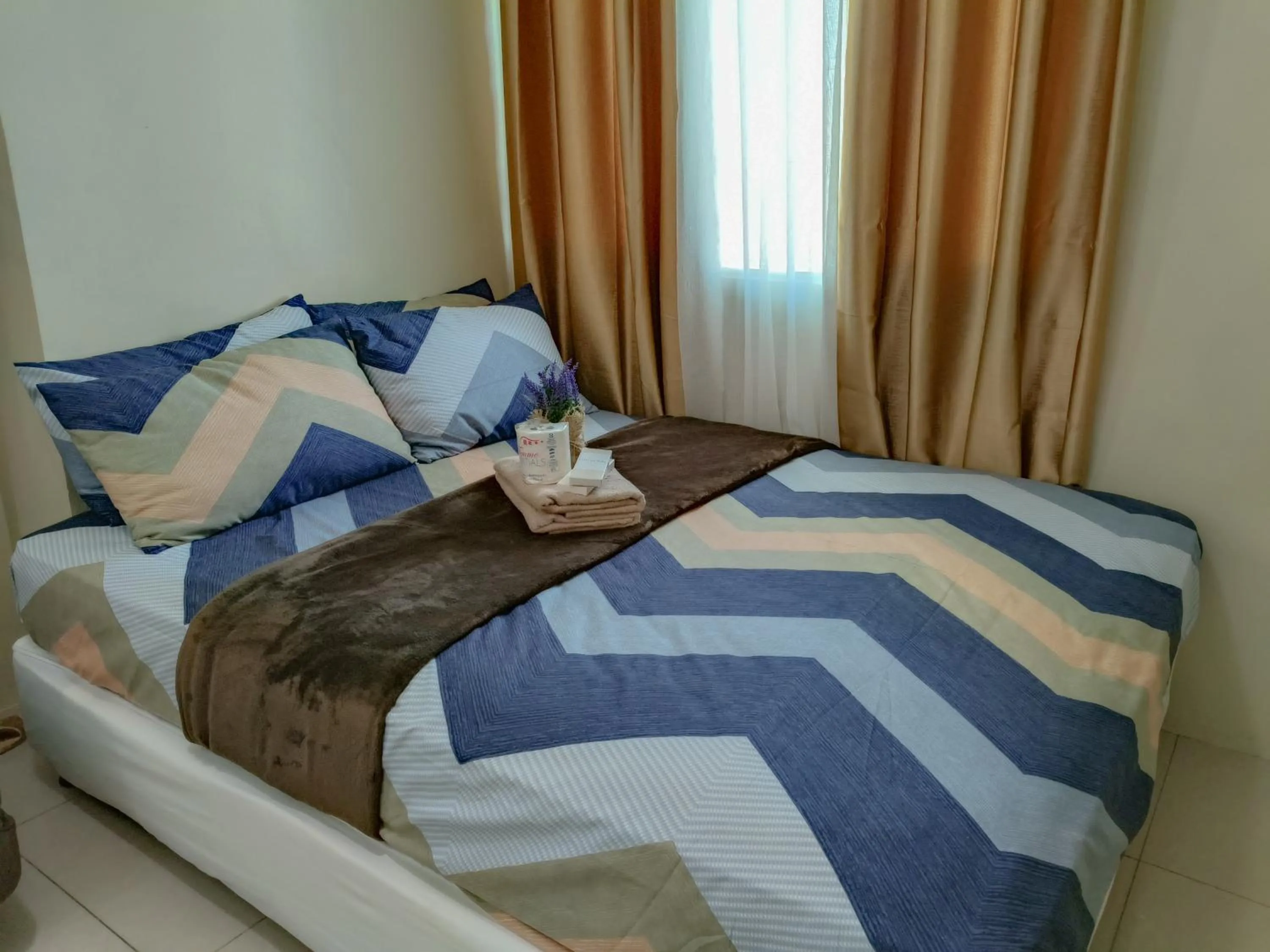 Bed in The Beacon Makati by Cozi Condotels