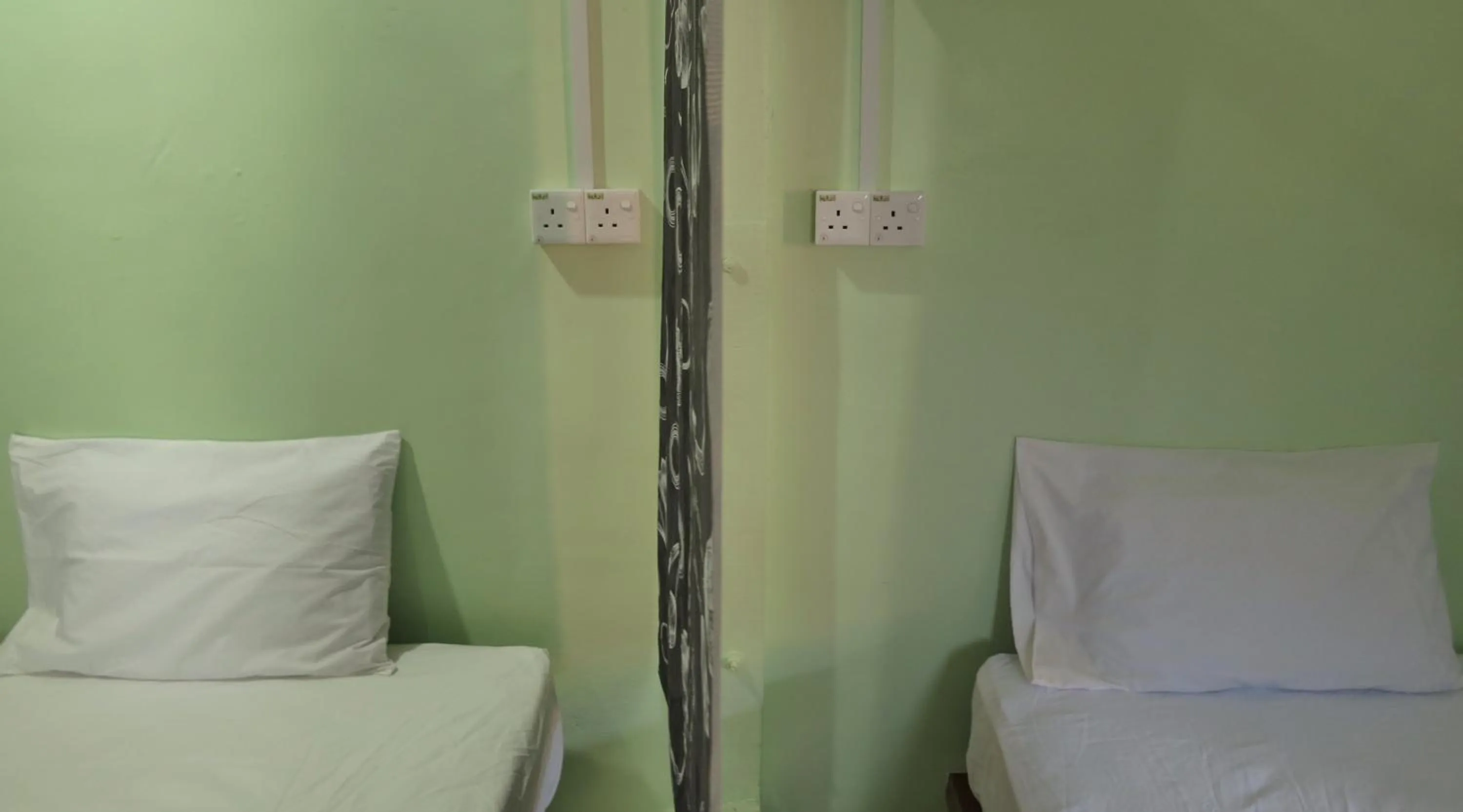 Bed in Pangkor Guesthouse SPK