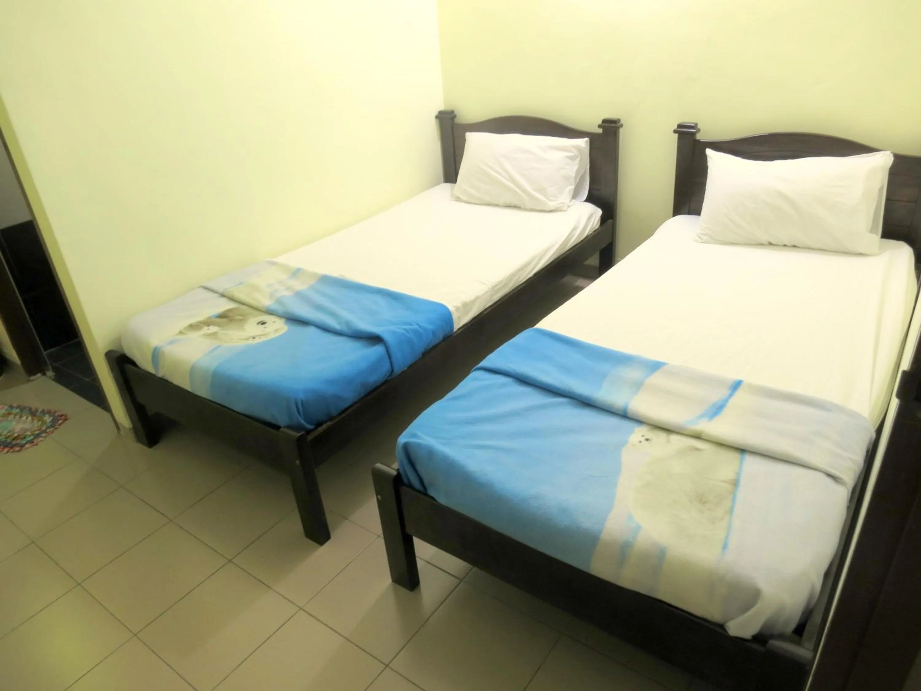 Bed in Pangkor Guesthouse SPK