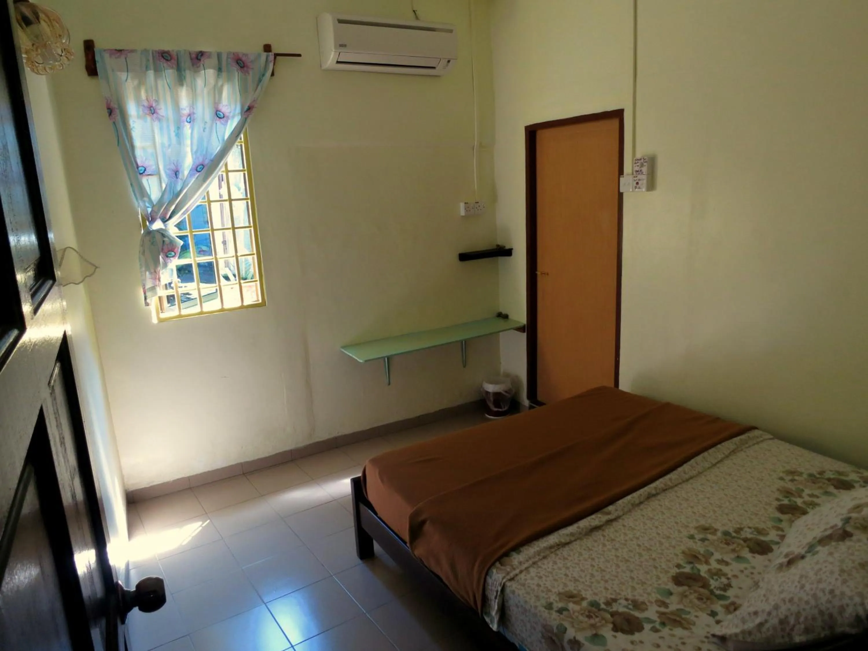 Bed in Pangkor Guesthouse SPK