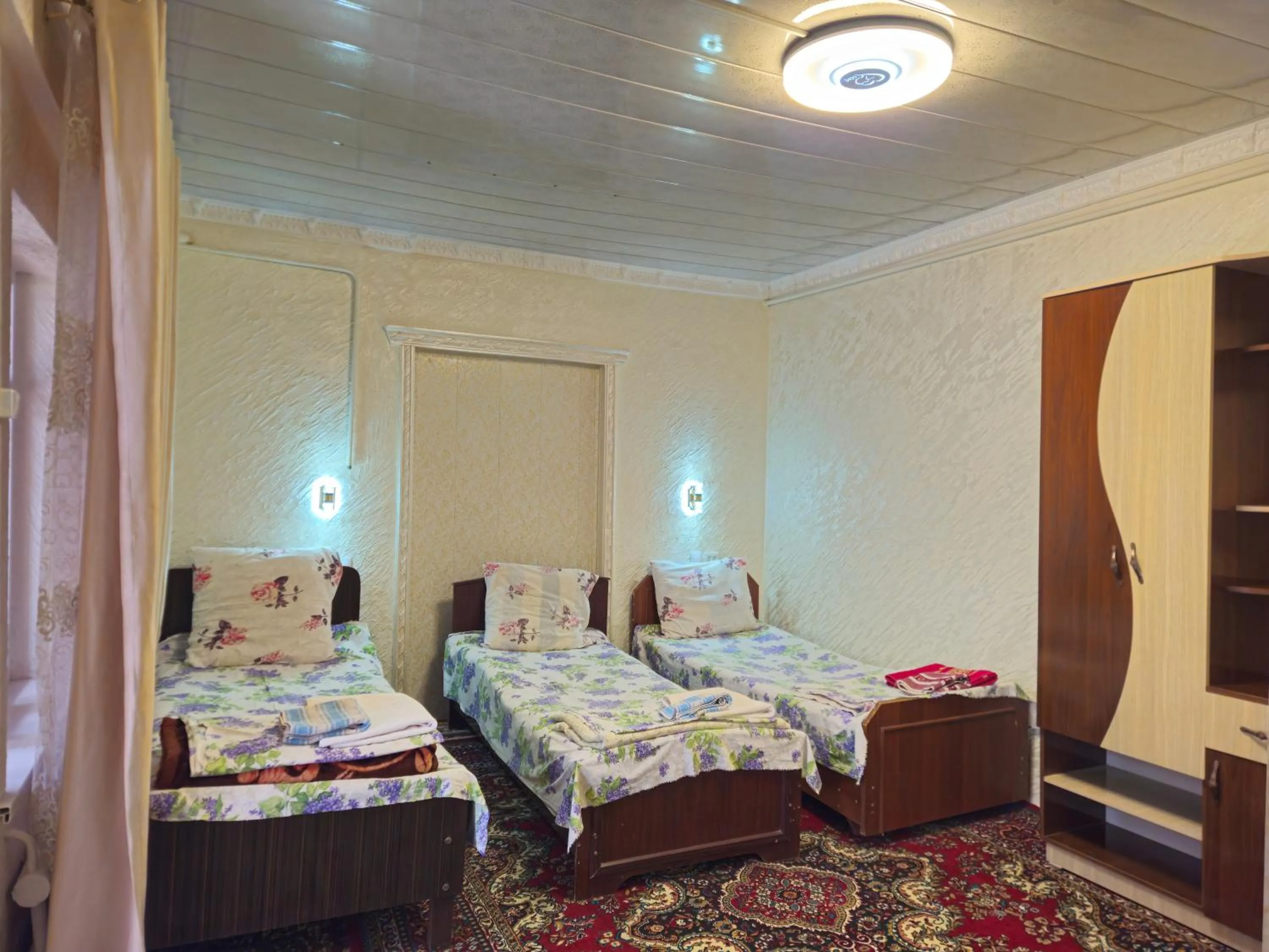 Bed in B&B Bahodir