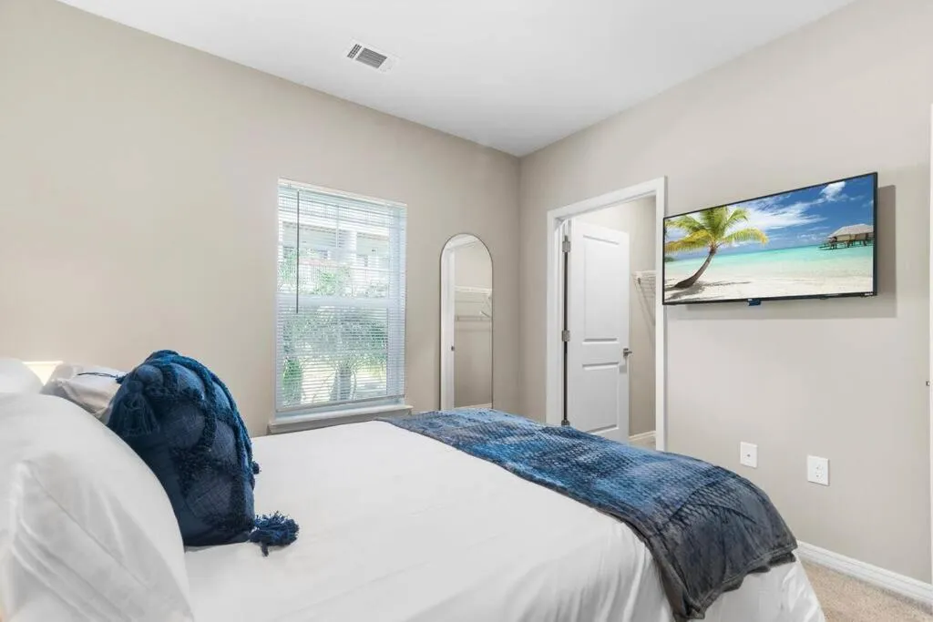 Bed in Luxury Living: 1BR Condo w/ Resort-Style Amenities