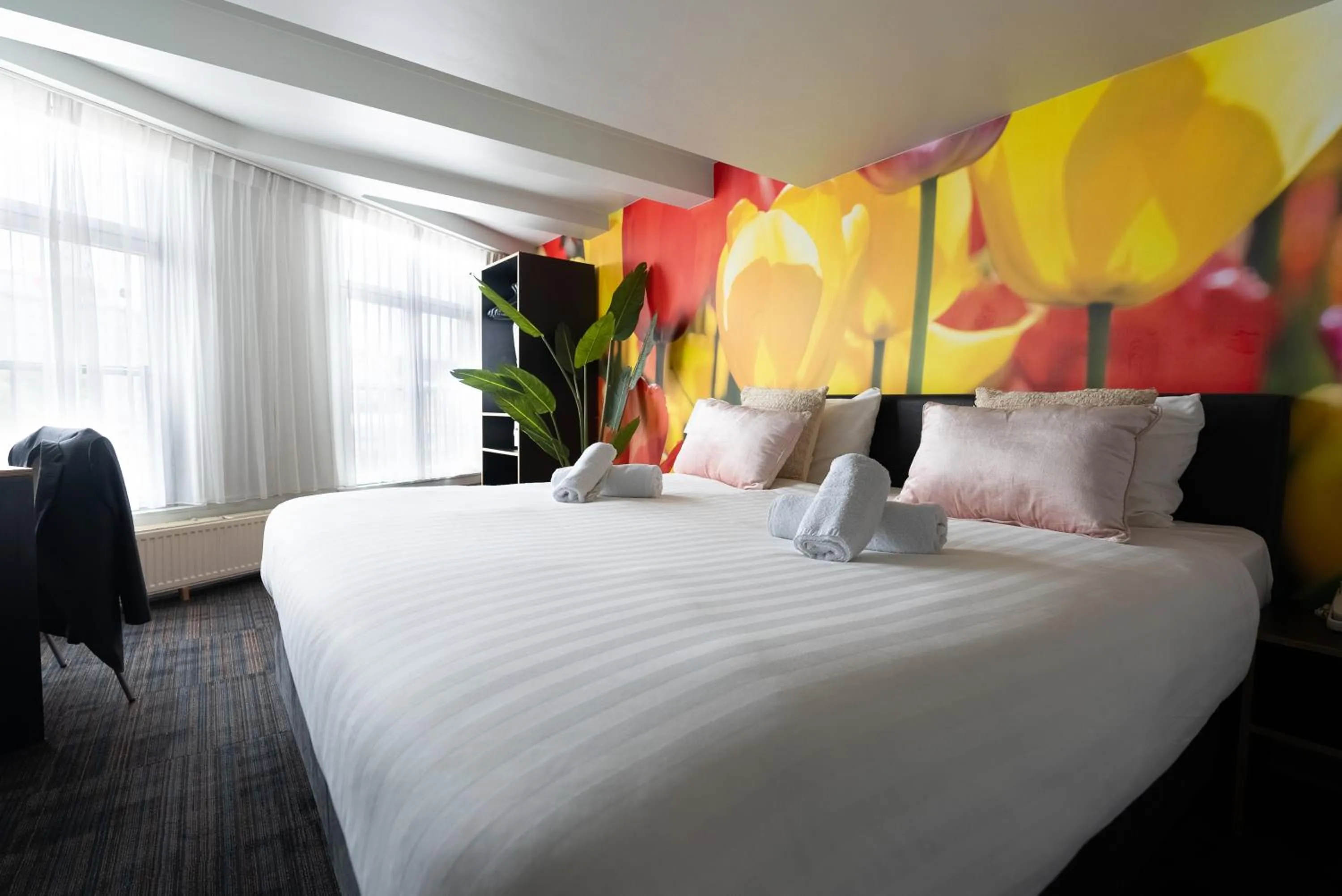 Bed in Multatuli Hotel