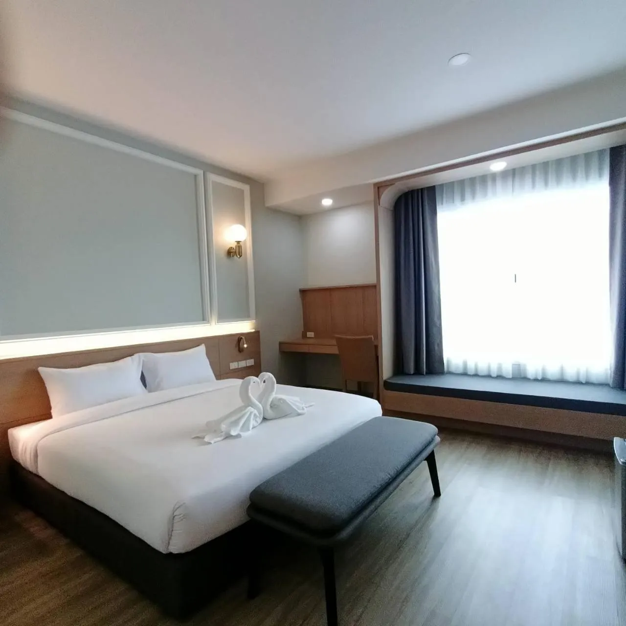 Bed in Mayflower Grande Suite Hotel