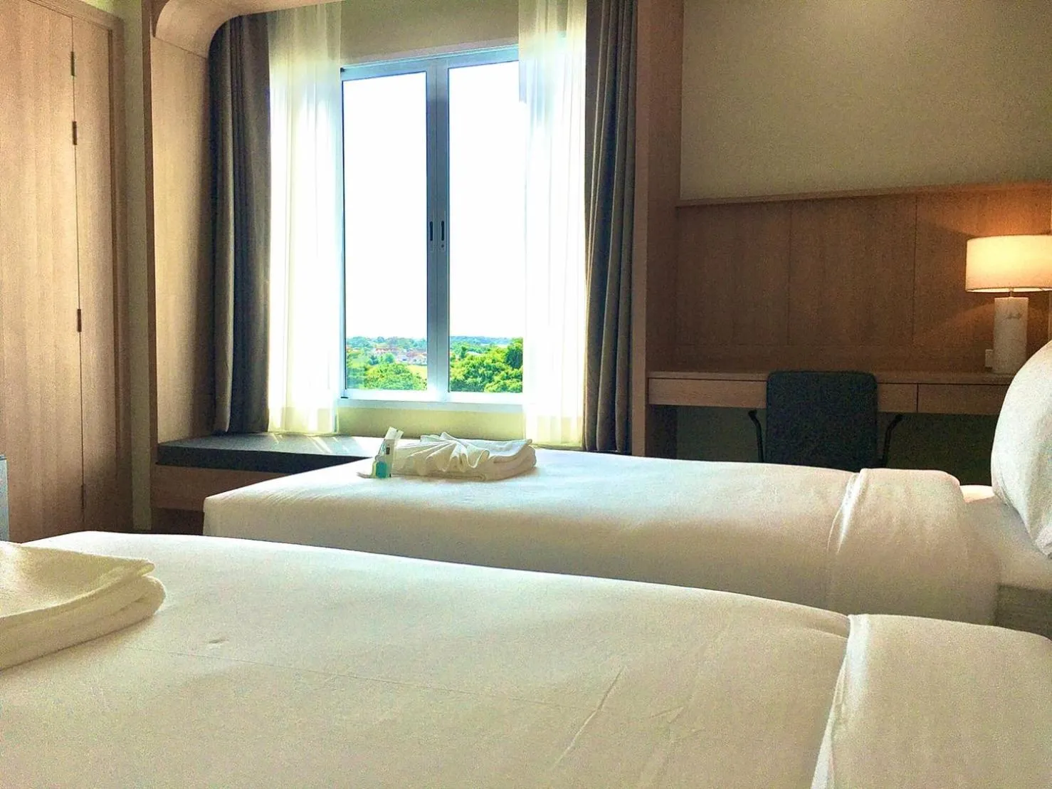 Bed in Mayflower Grande Suite Hotel