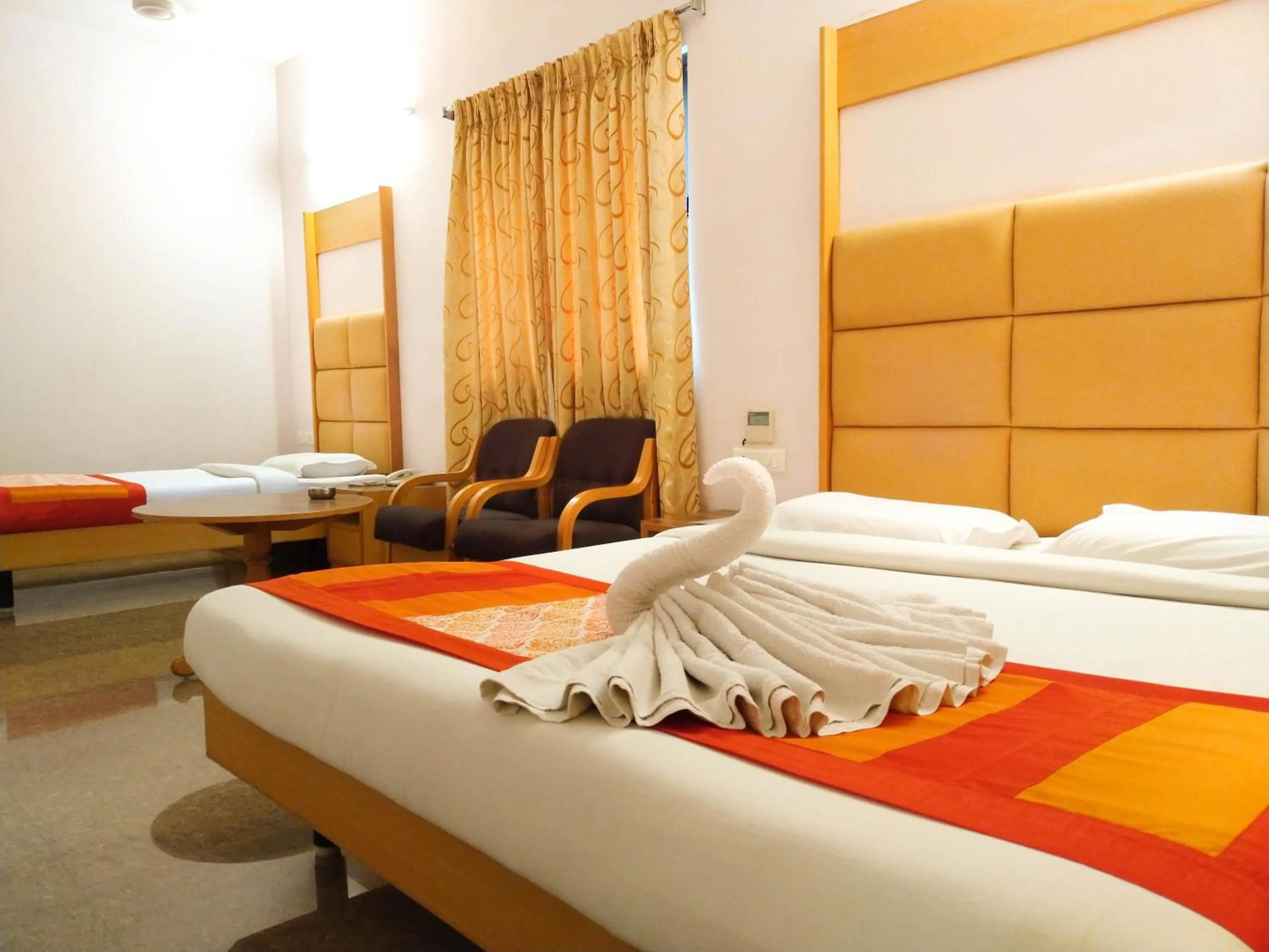 Bed in Hotel Rajadhane Madurai