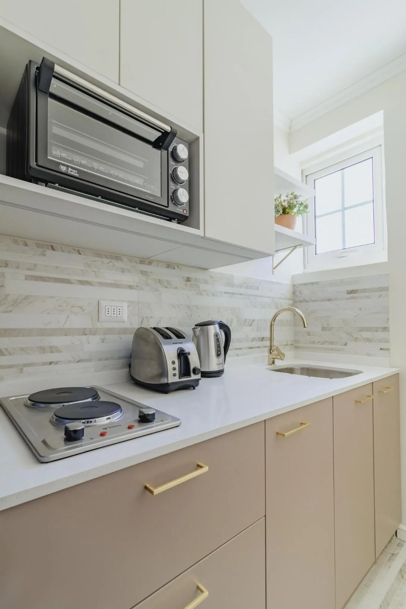 Kitchen or kitchenette in Orly Suites