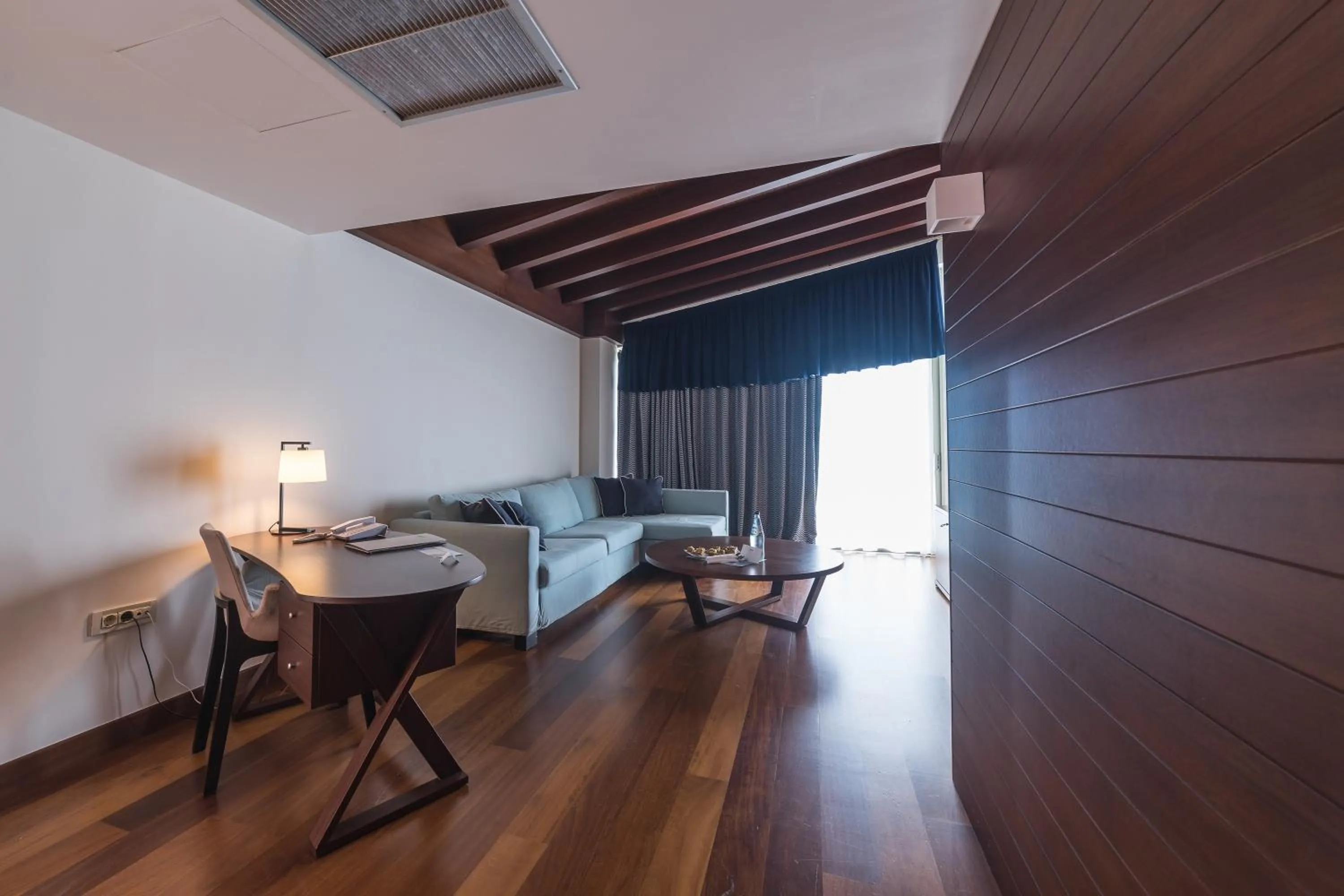 Seating area, Bed in Horizon Blu Boutique Hotel