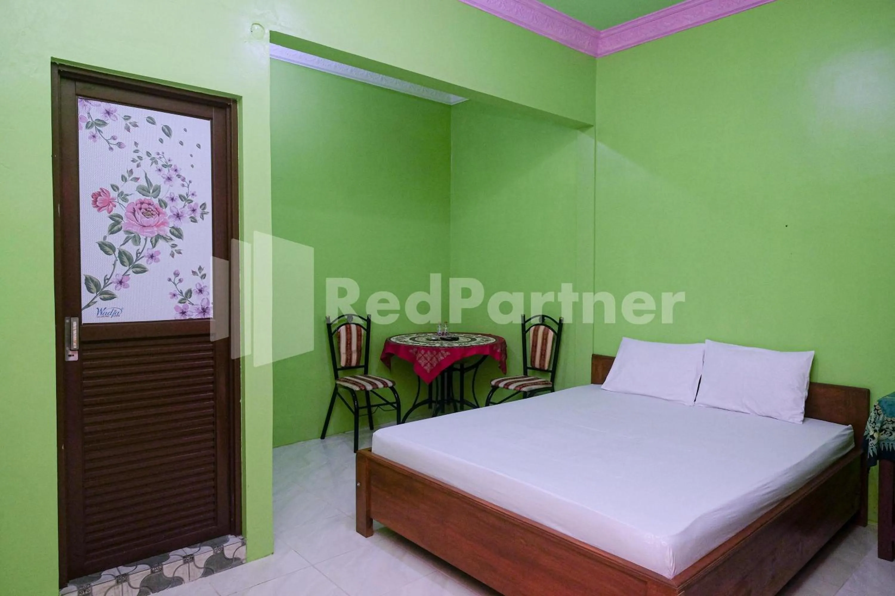 Bed in Wisma Giri Mulyo B near Grojogan Sewu Mitra RedDoorz