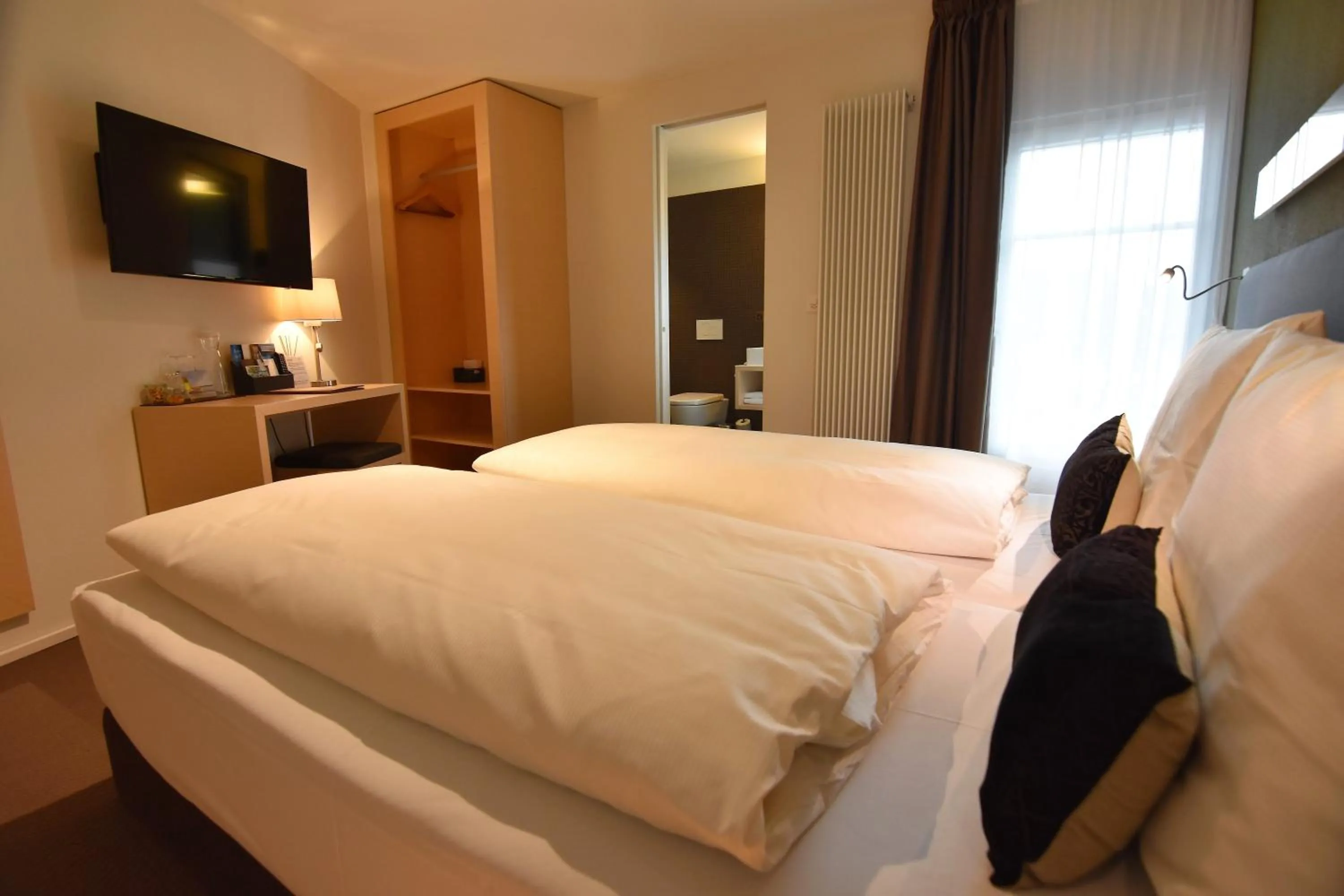 Bed in JUCKERs Boutique-Hotel