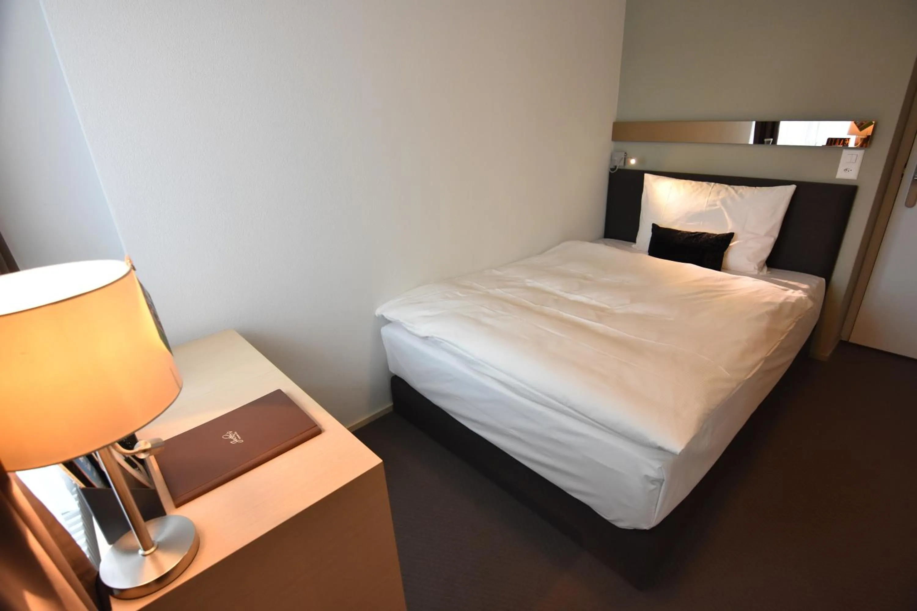 Bed in JUCKERs Boutique-Hotel