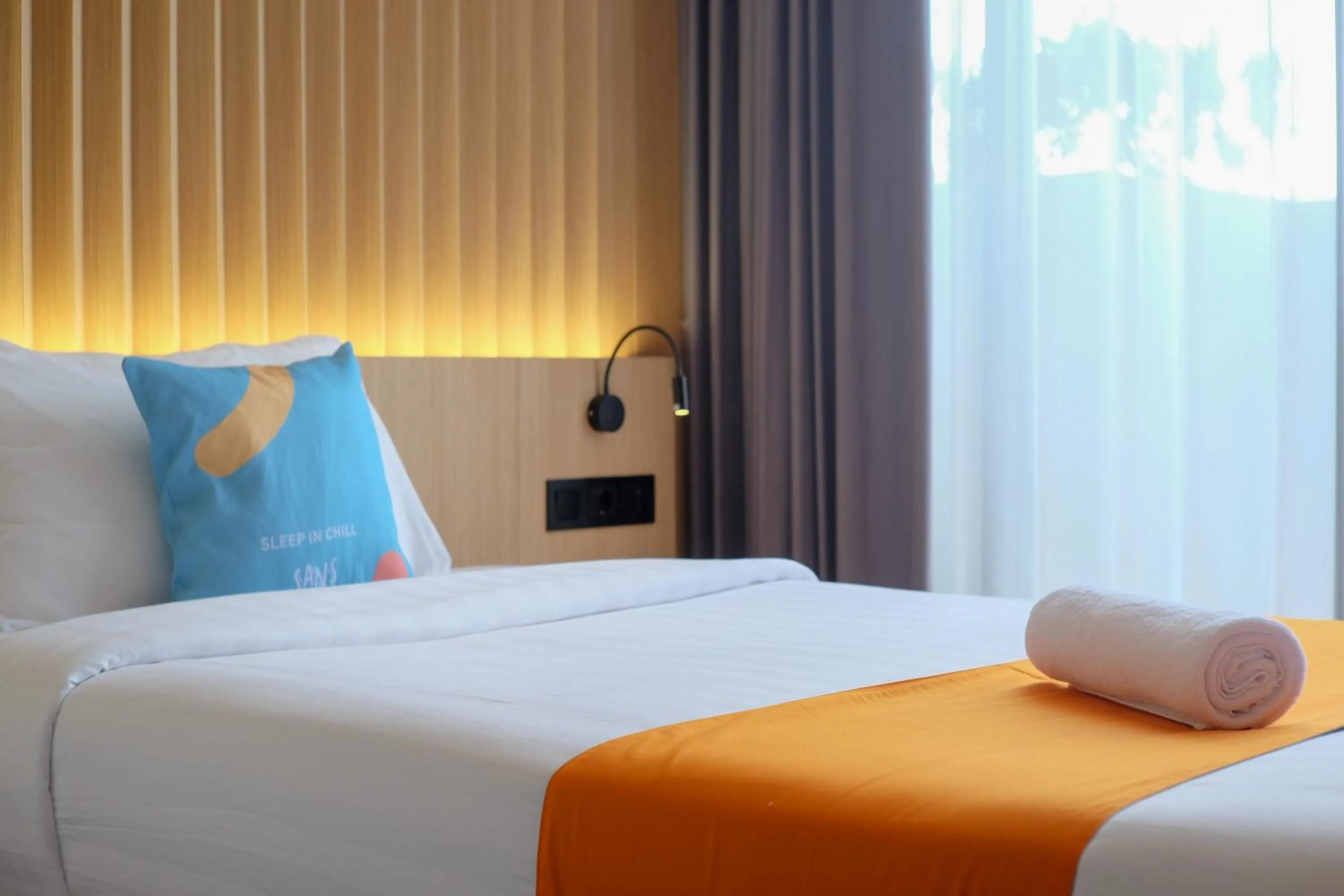 Bed in Sans Hotel RG Living Jogja by RedDoorz