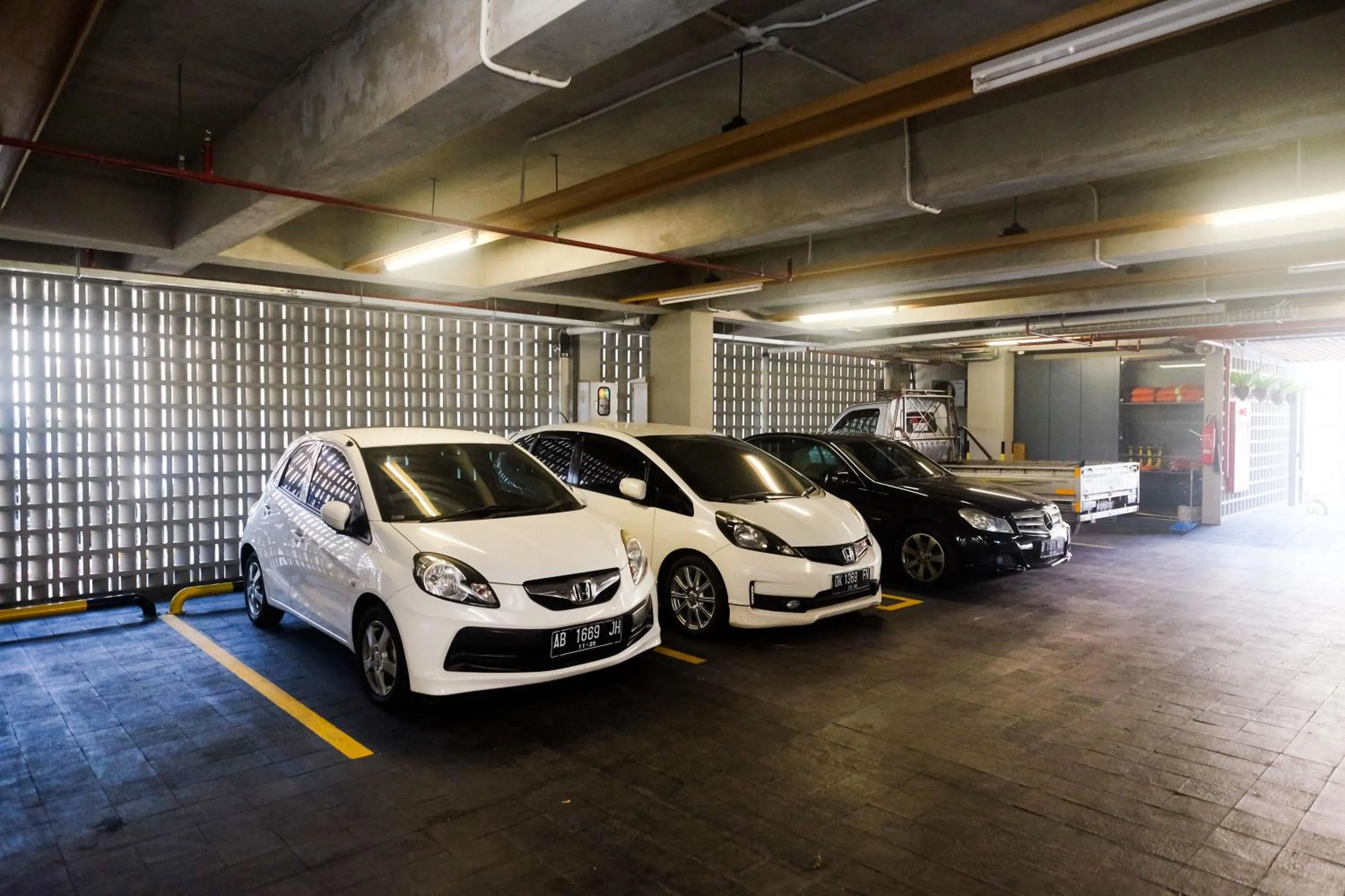 Parking in Sans Hotel RG Living Jogja by RedDoorz