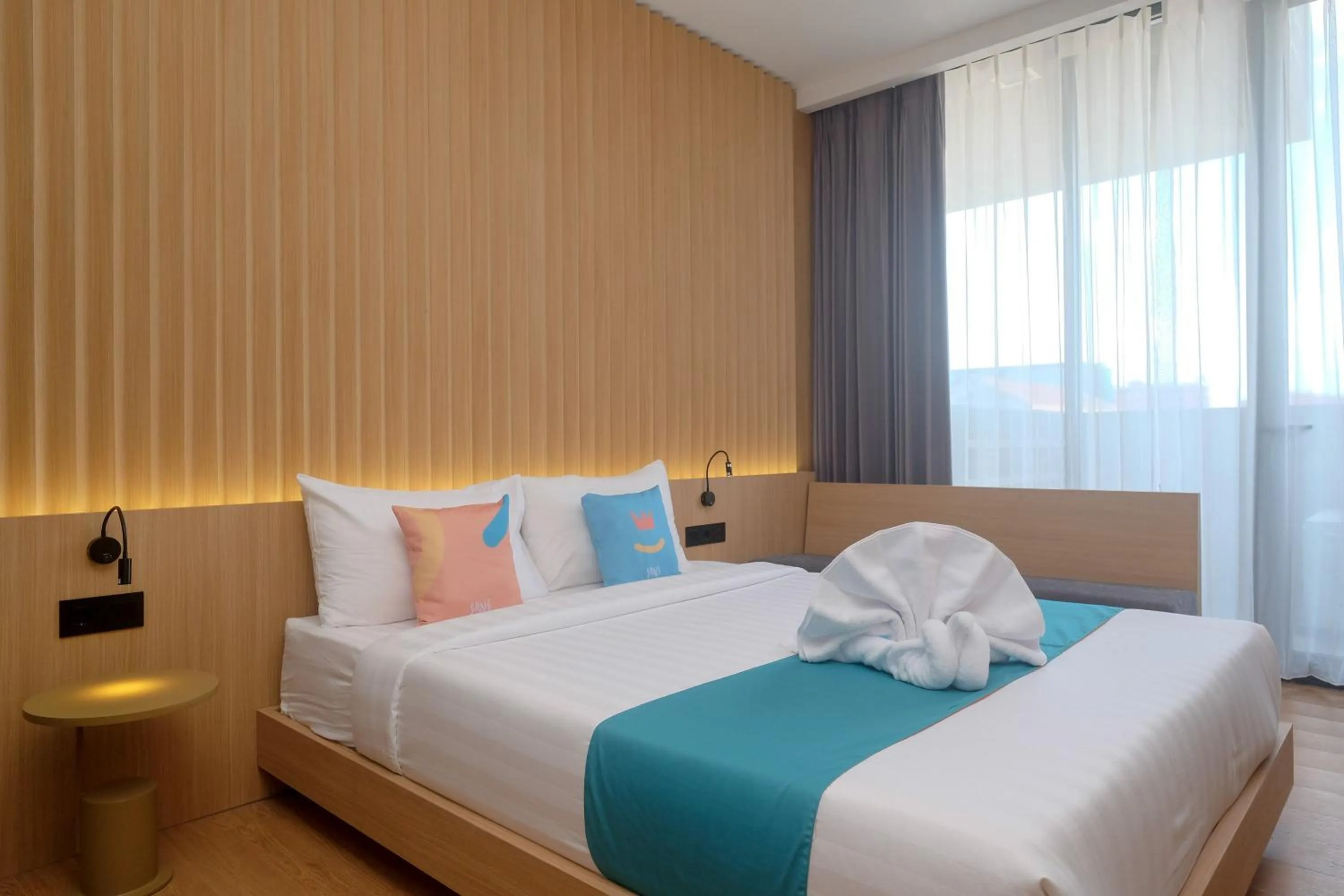 Bed in Sans Hotel RG Living Jogja by RedDoorz