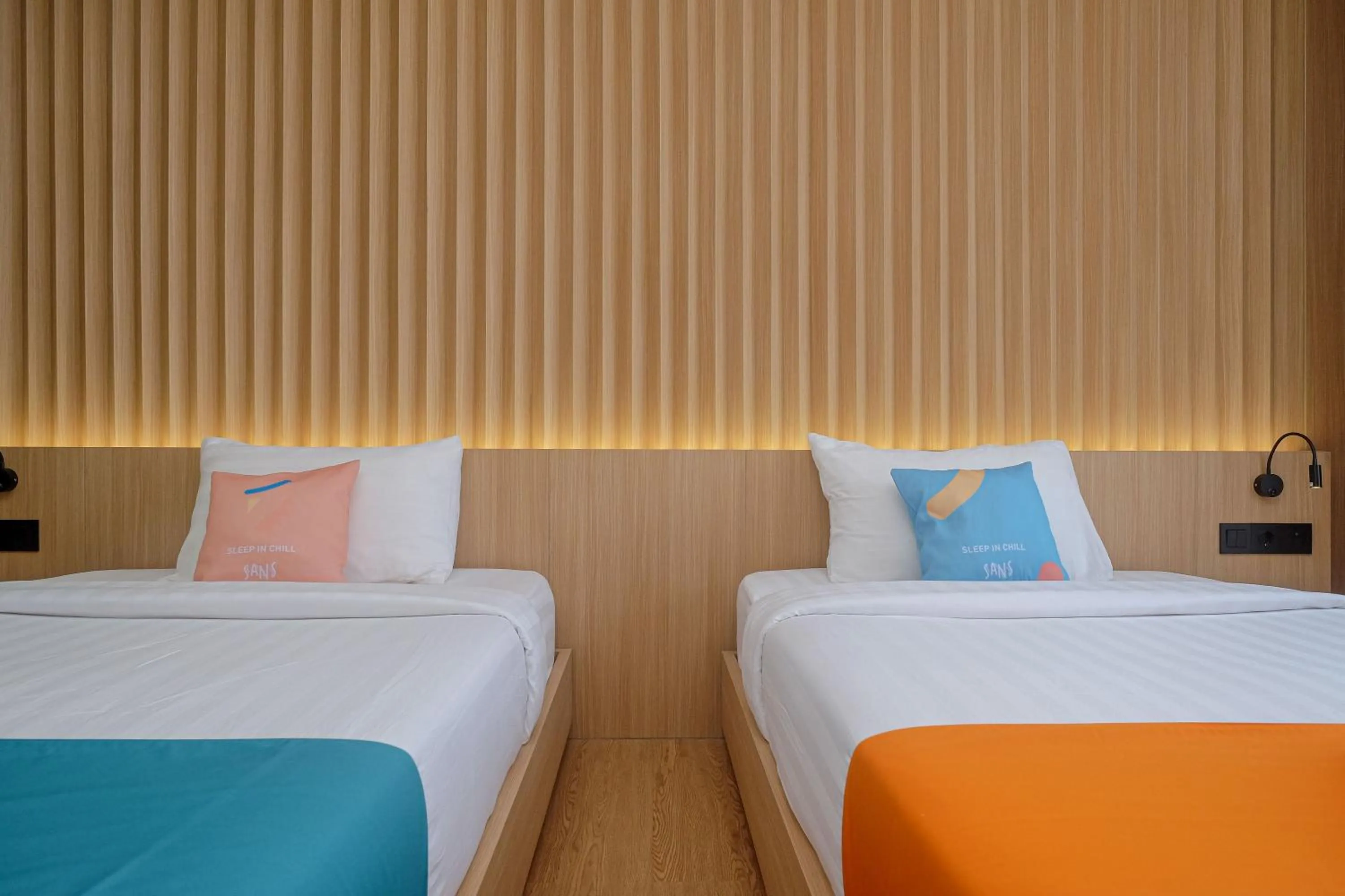 Bed in Sans Hotel RG Living Jogja by RedDoorz