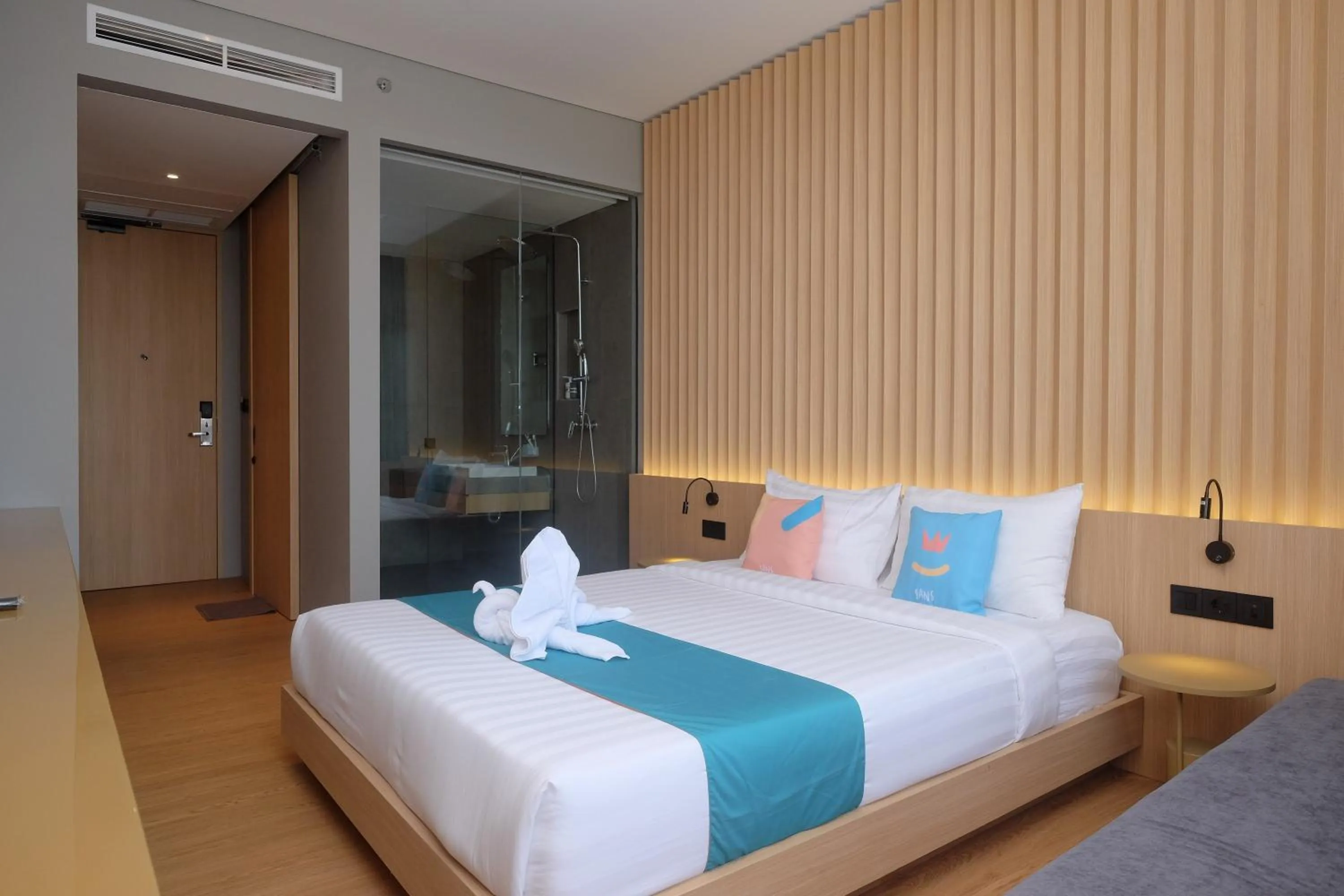 Bed in Sans Hotel RG Living Jogja by RedDoorz