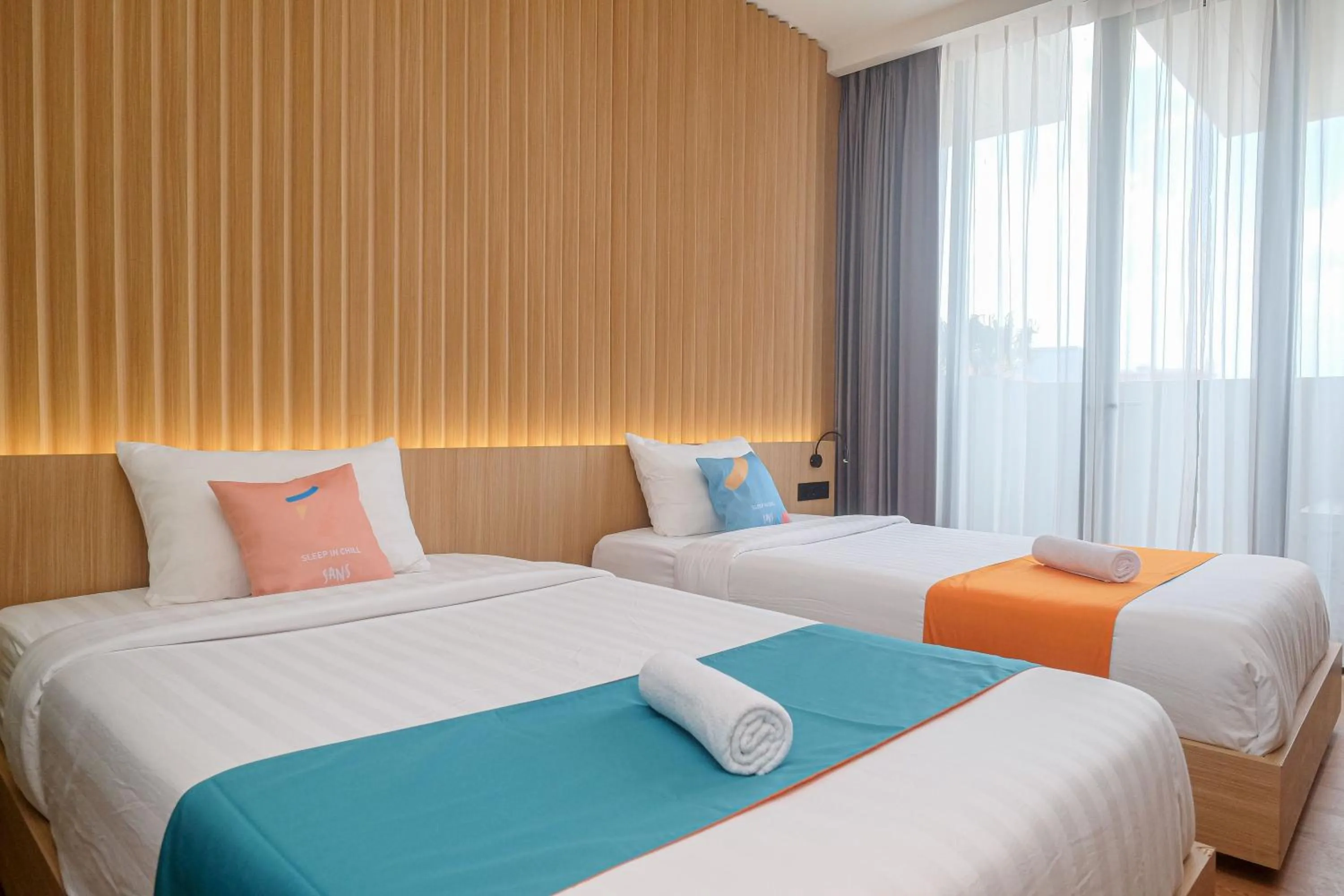 Bed in Sans Hotel RG Living Jogja by RedDoorz
