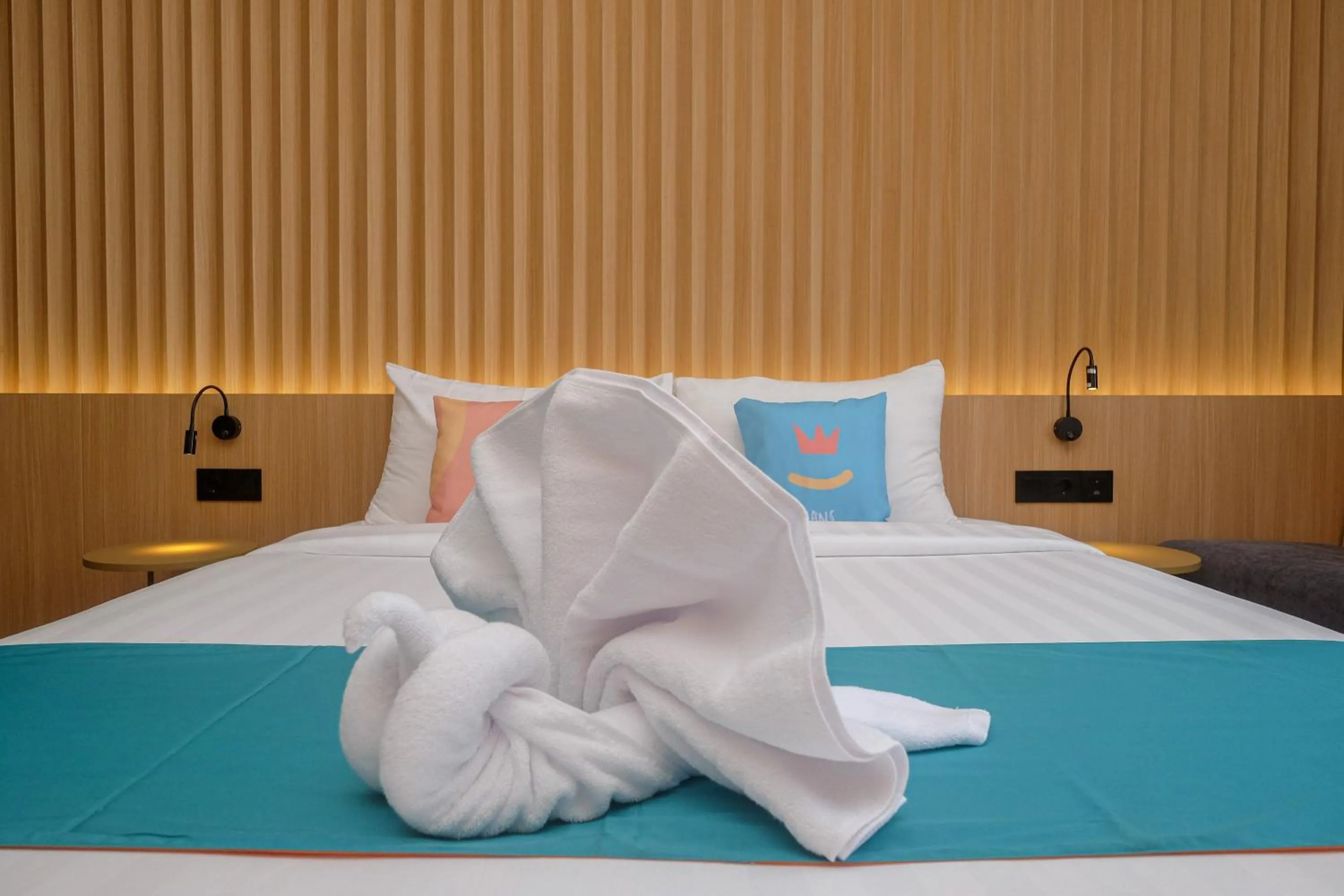 Bed in Sans Hotel RG Living Jogja by RedDoorz