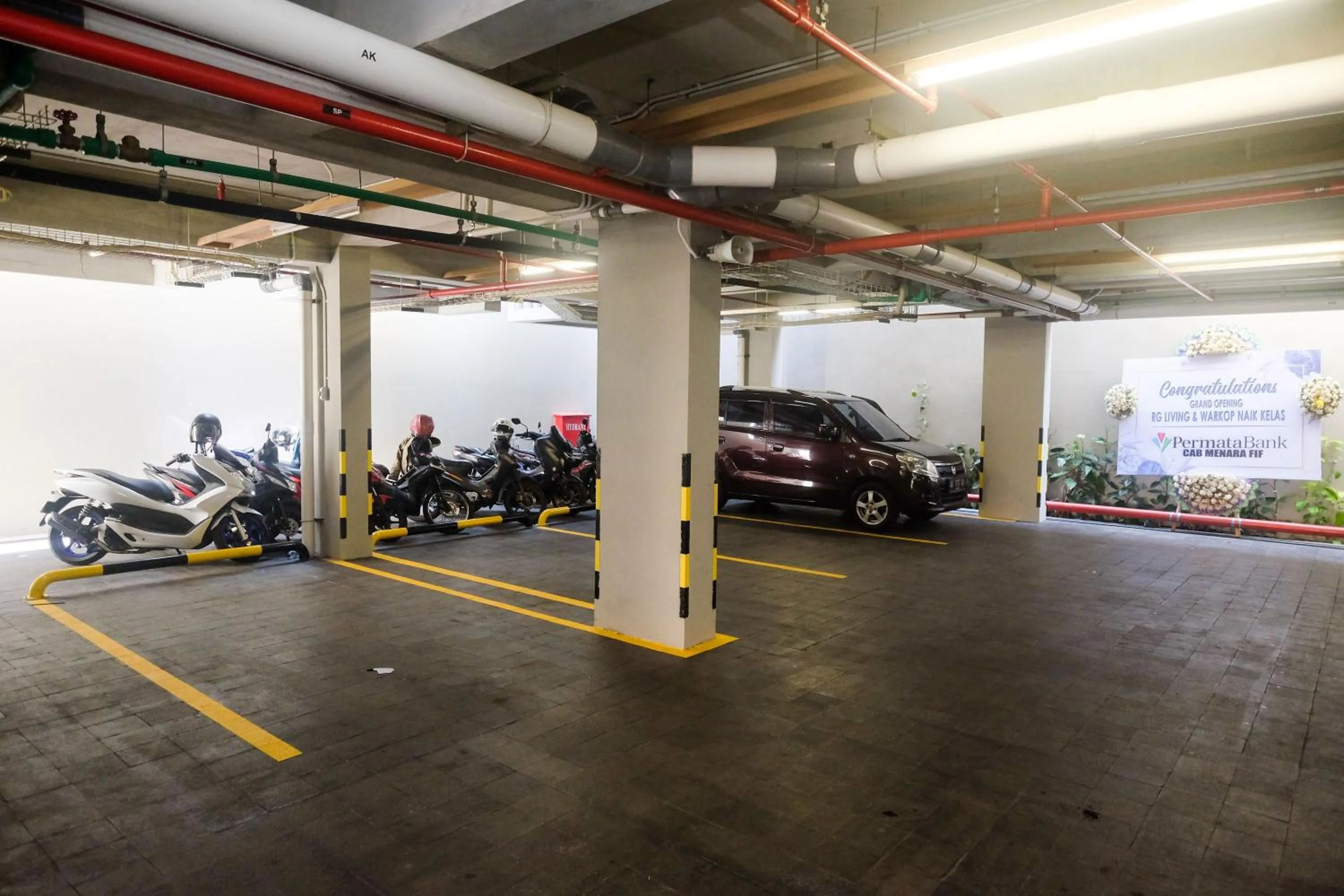 Parking in Sans Hotel RG Living Jogja by RedDoorz