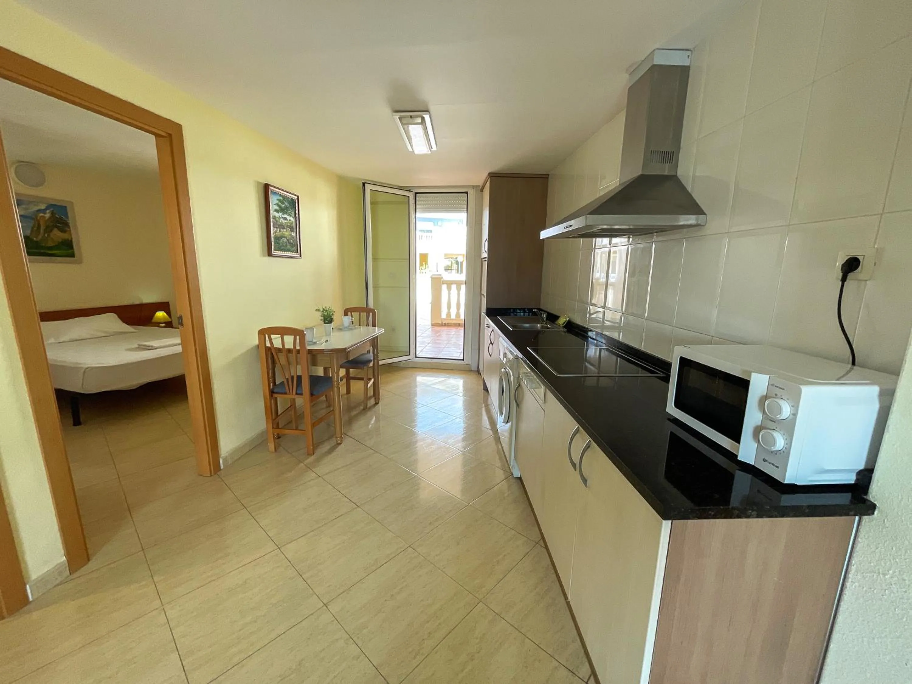 Kitchen or kitchenette in Apartamentos Marcomar 3000