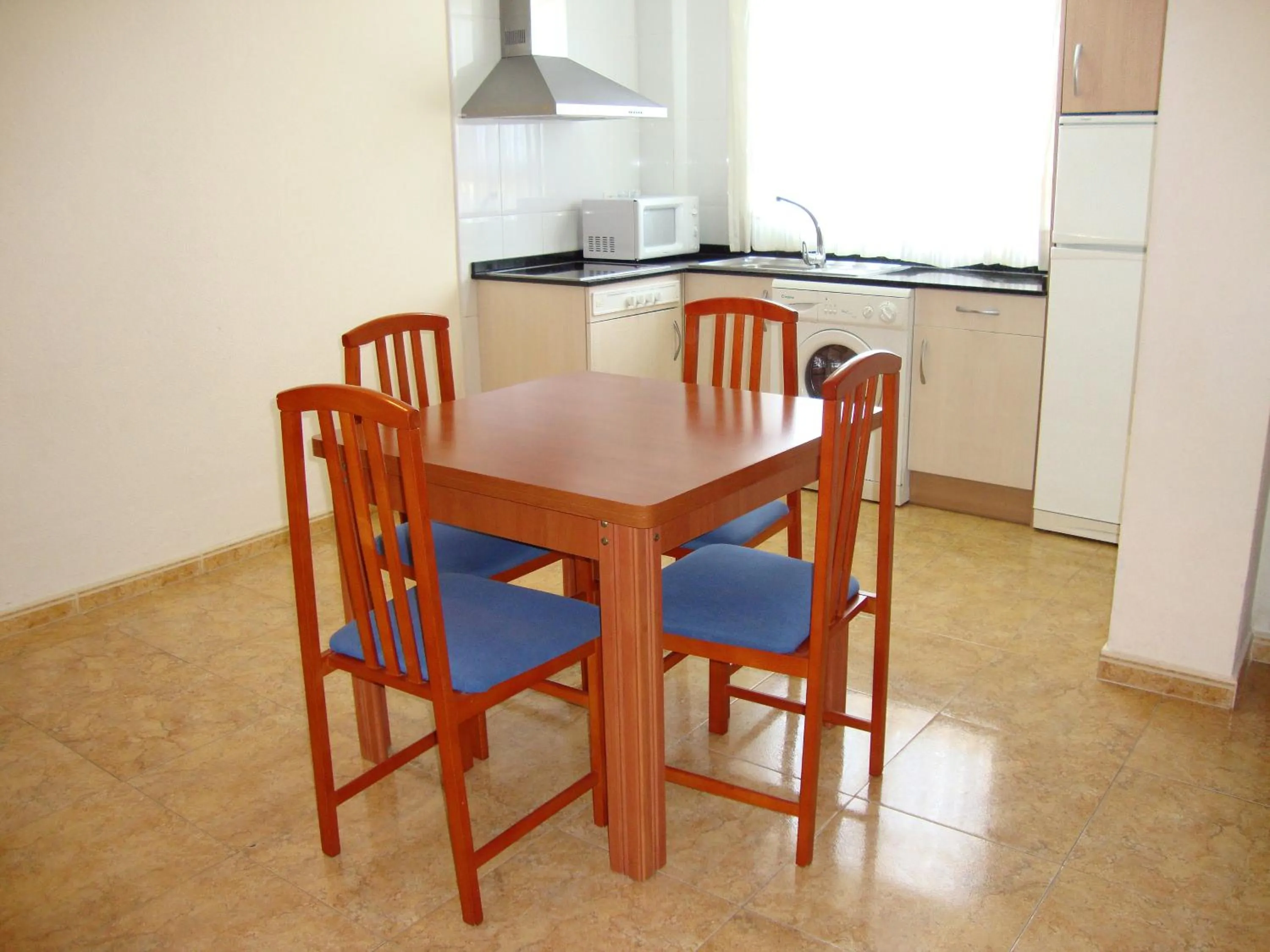 Kitchen or kitchenette in Apartamentos Marcomar 3000