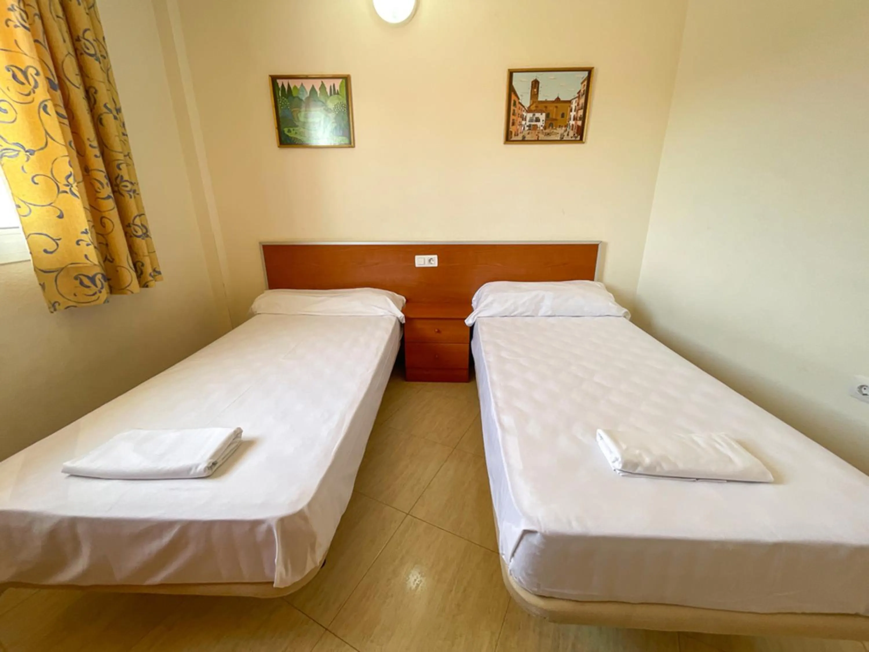 Bed in Apartamentos Marcomar 3000