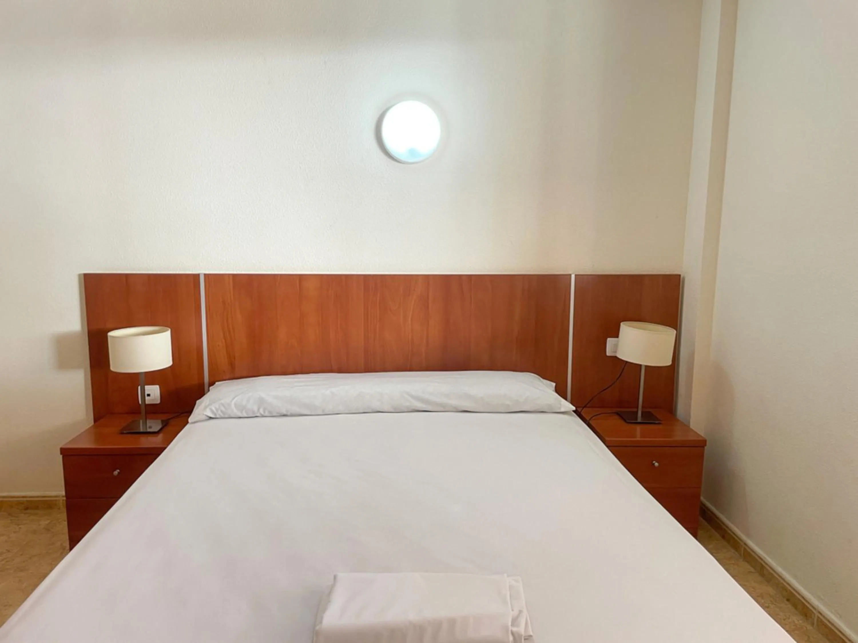 Bed in Apartamentos Marcomar 3000