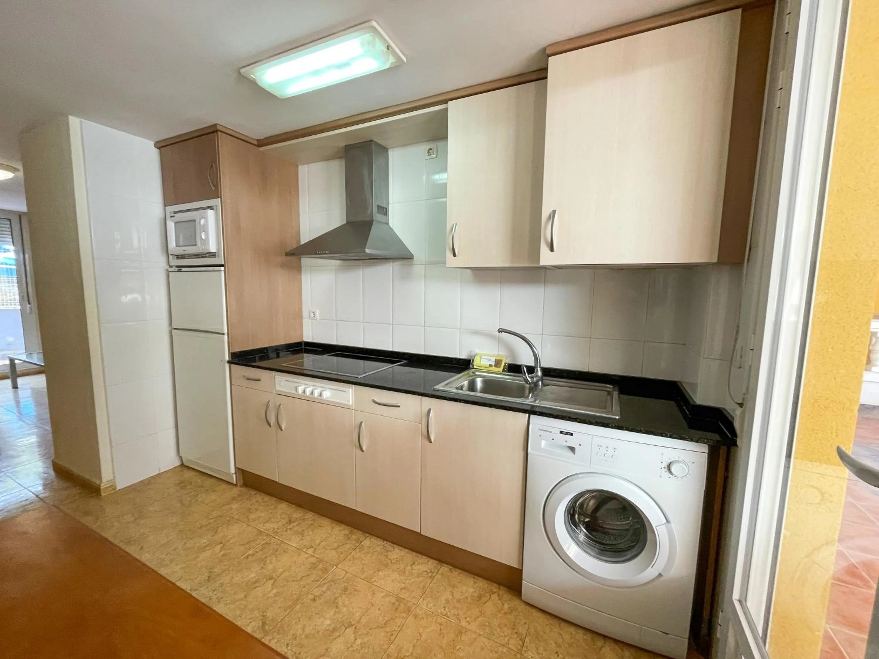 Kitchen or kitchenette in Apartamentos Marcomar 3000