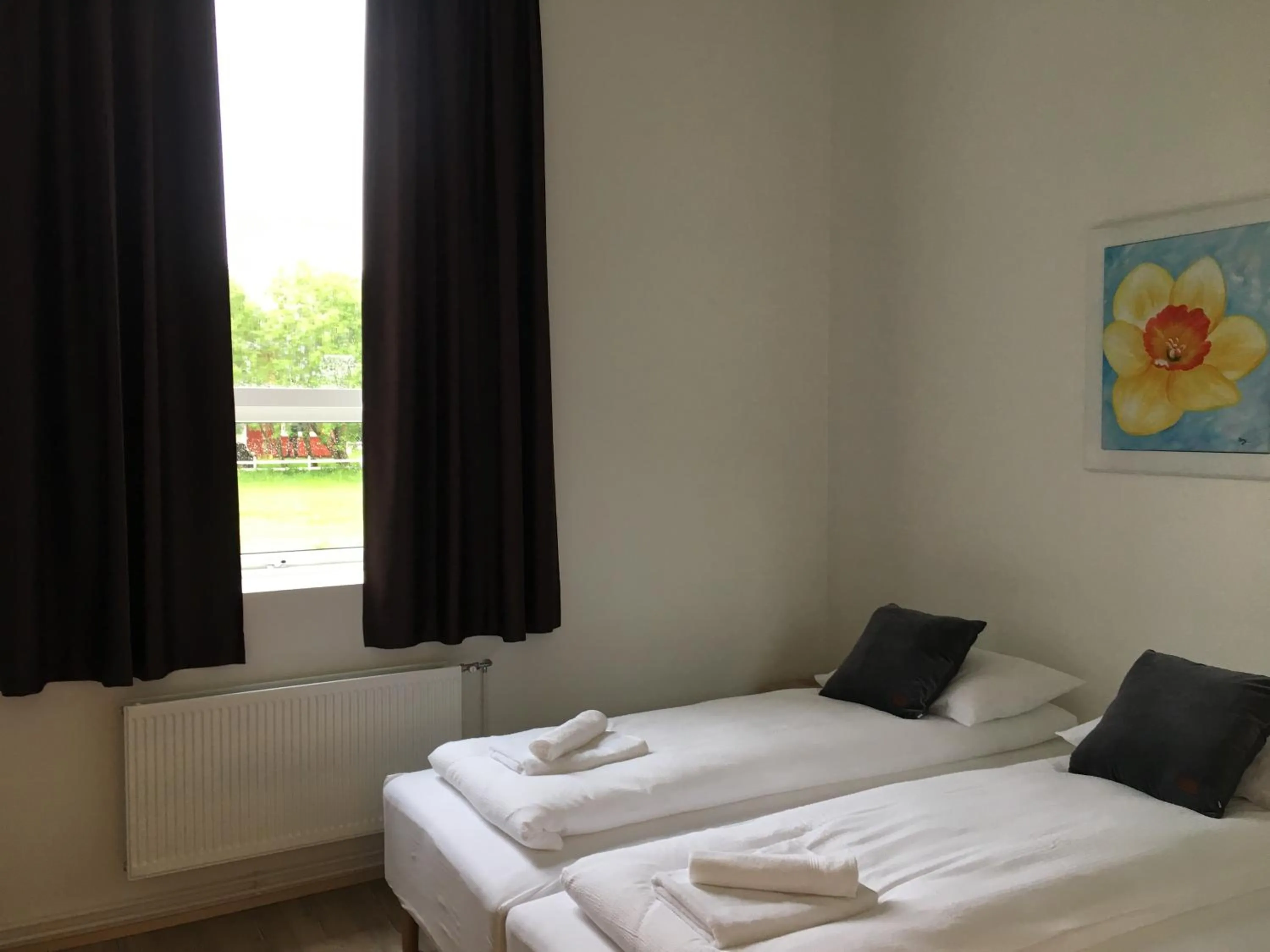 Bed in Welcome Riverside Guesthouse