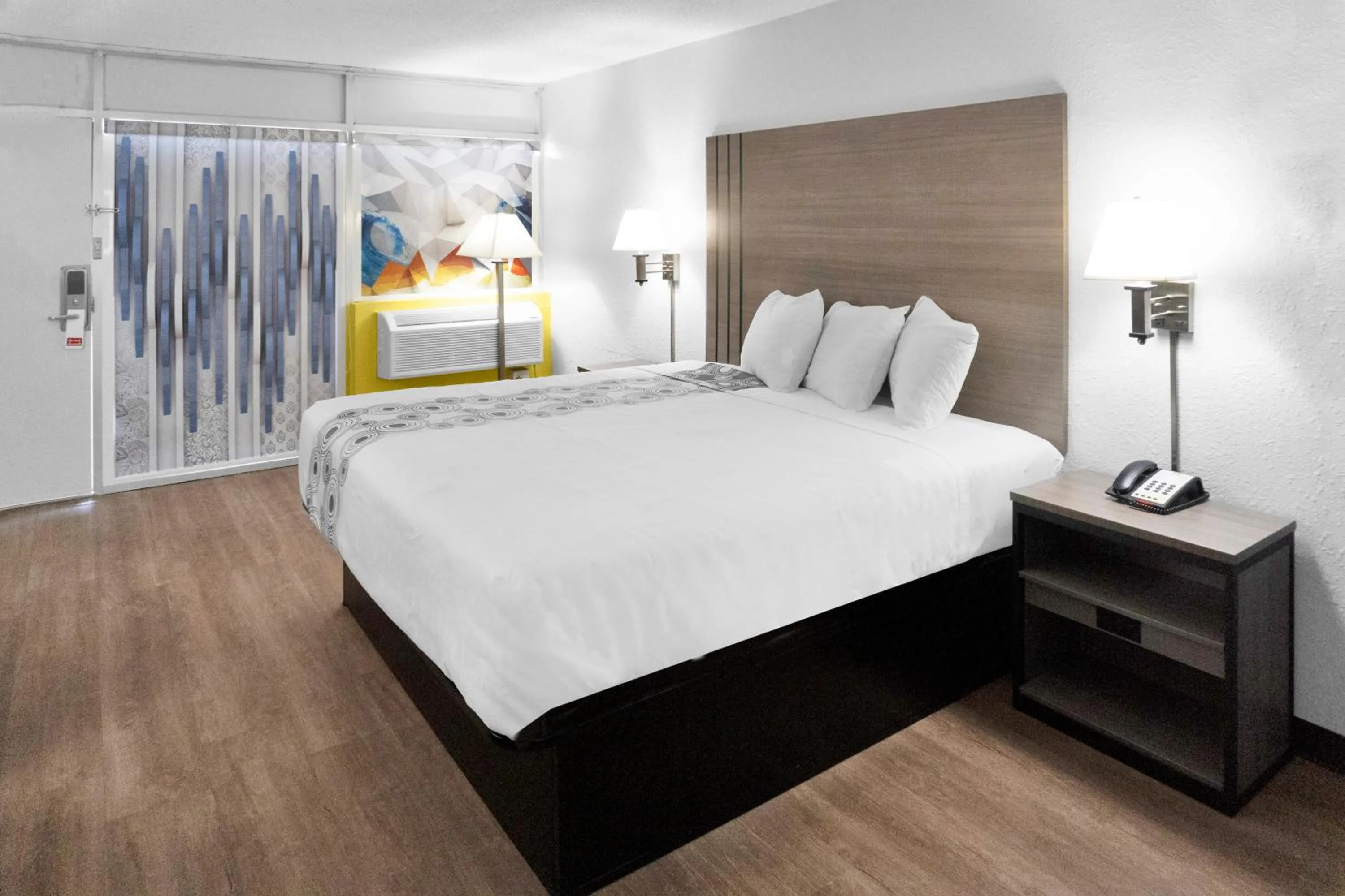 Bed in Hometown Inn + Kitchen