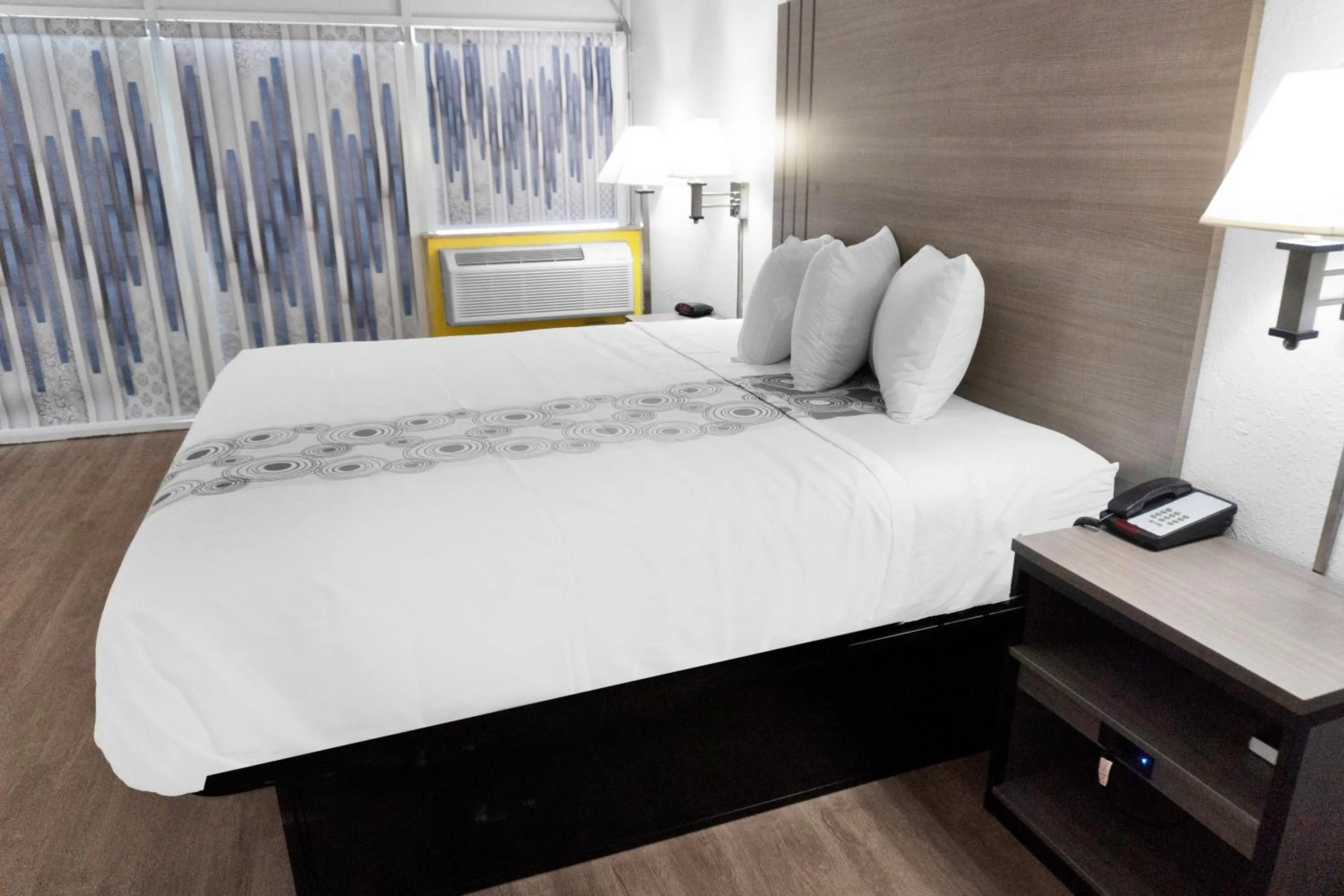 Bed in Hometown Inn + Kitchen