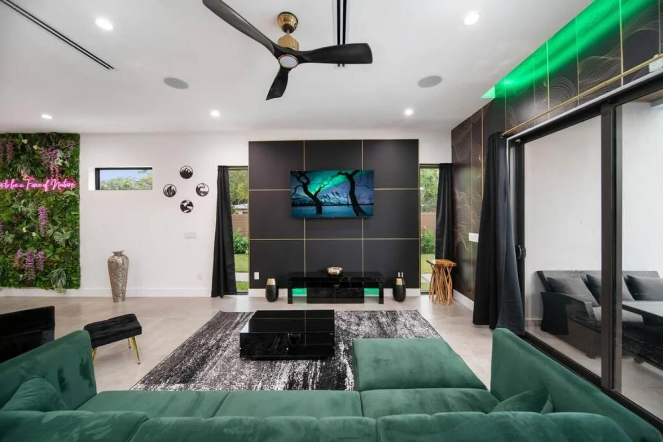Living room in The Elements Home with 2 Pools