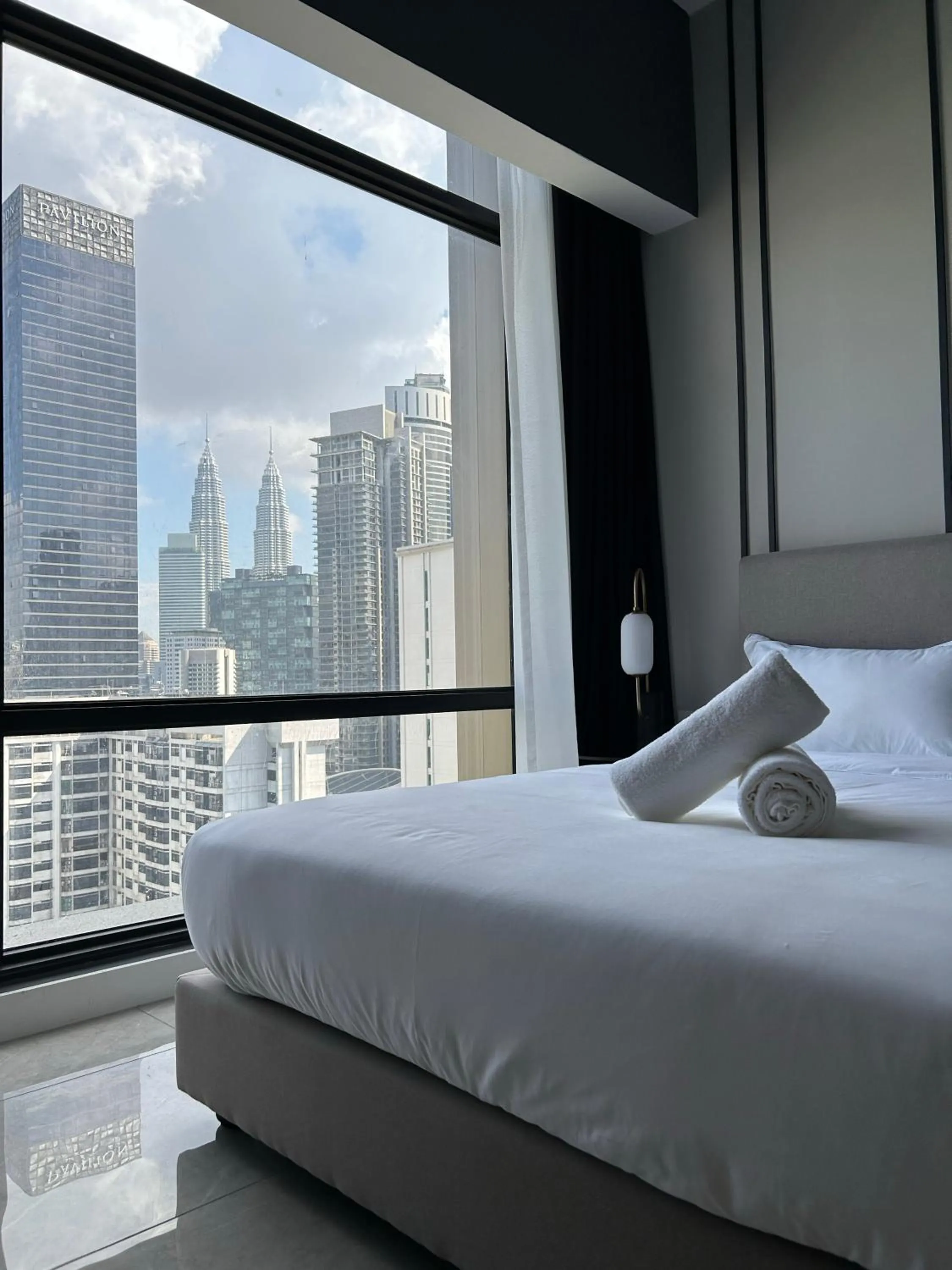 Bed in Axon Residence at Pavilion KLCC KL Tower view by KIMIRO