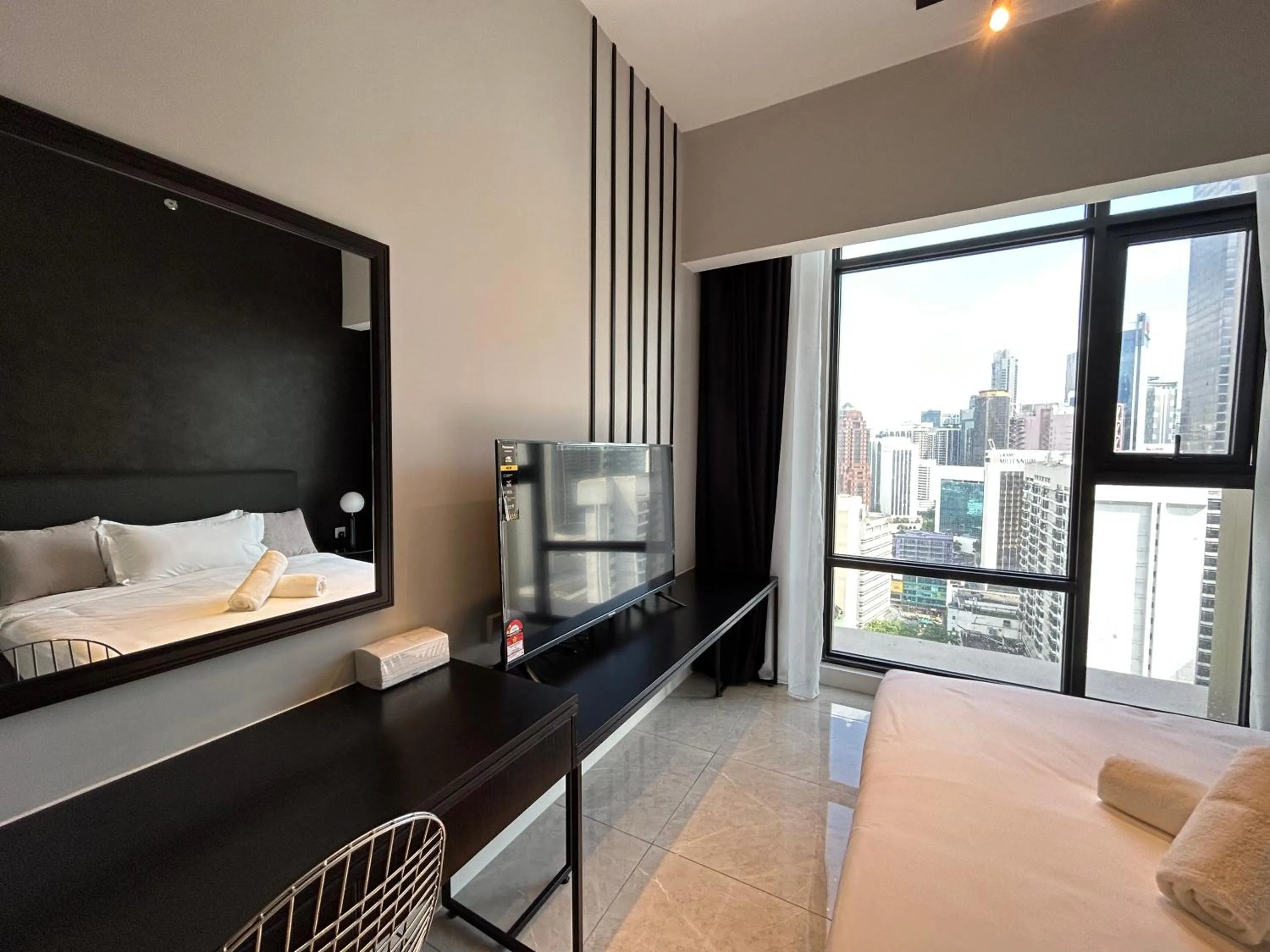 Bed in Axon Residence at Pavilion KLCC KL Tower view by KIMIRO