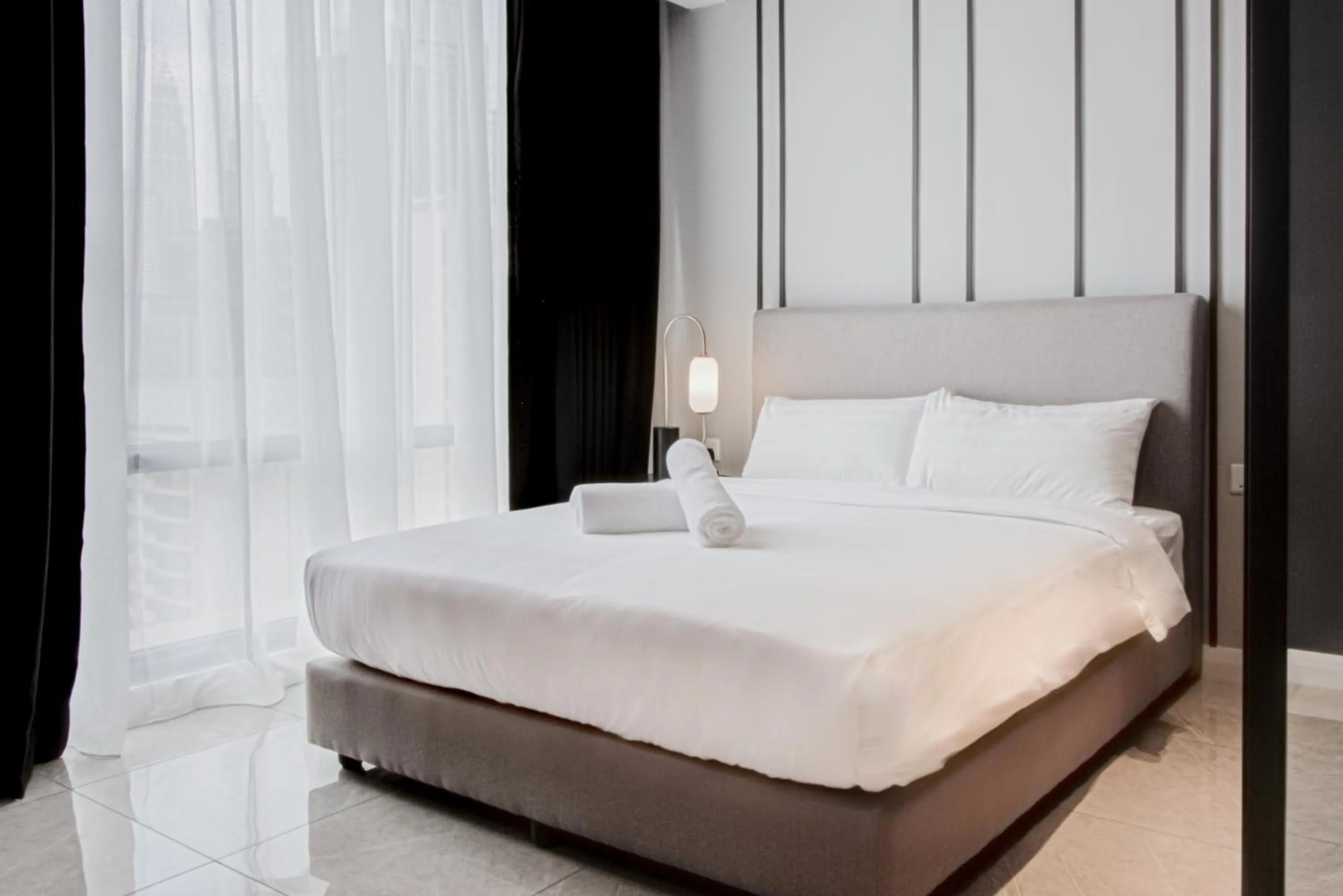 Bed in Axon Residence at Pavilion KLCC KL Tower view by KIMIRO