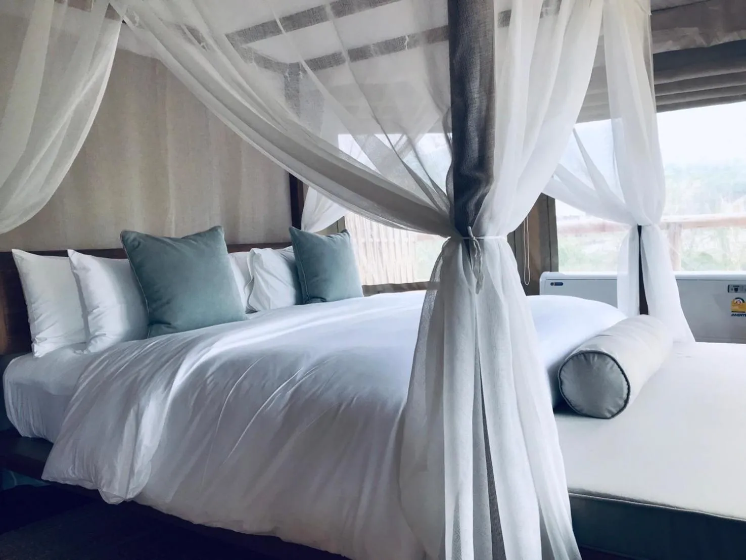Bed in Tantawan Tented Camp by Dusit, Chiang Rai