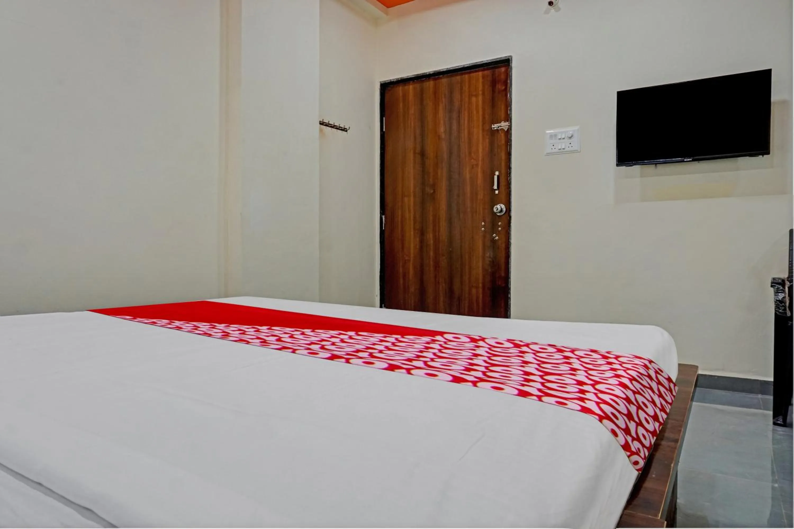 Bedroom in OYO Flagship Sai Balaji Lodge