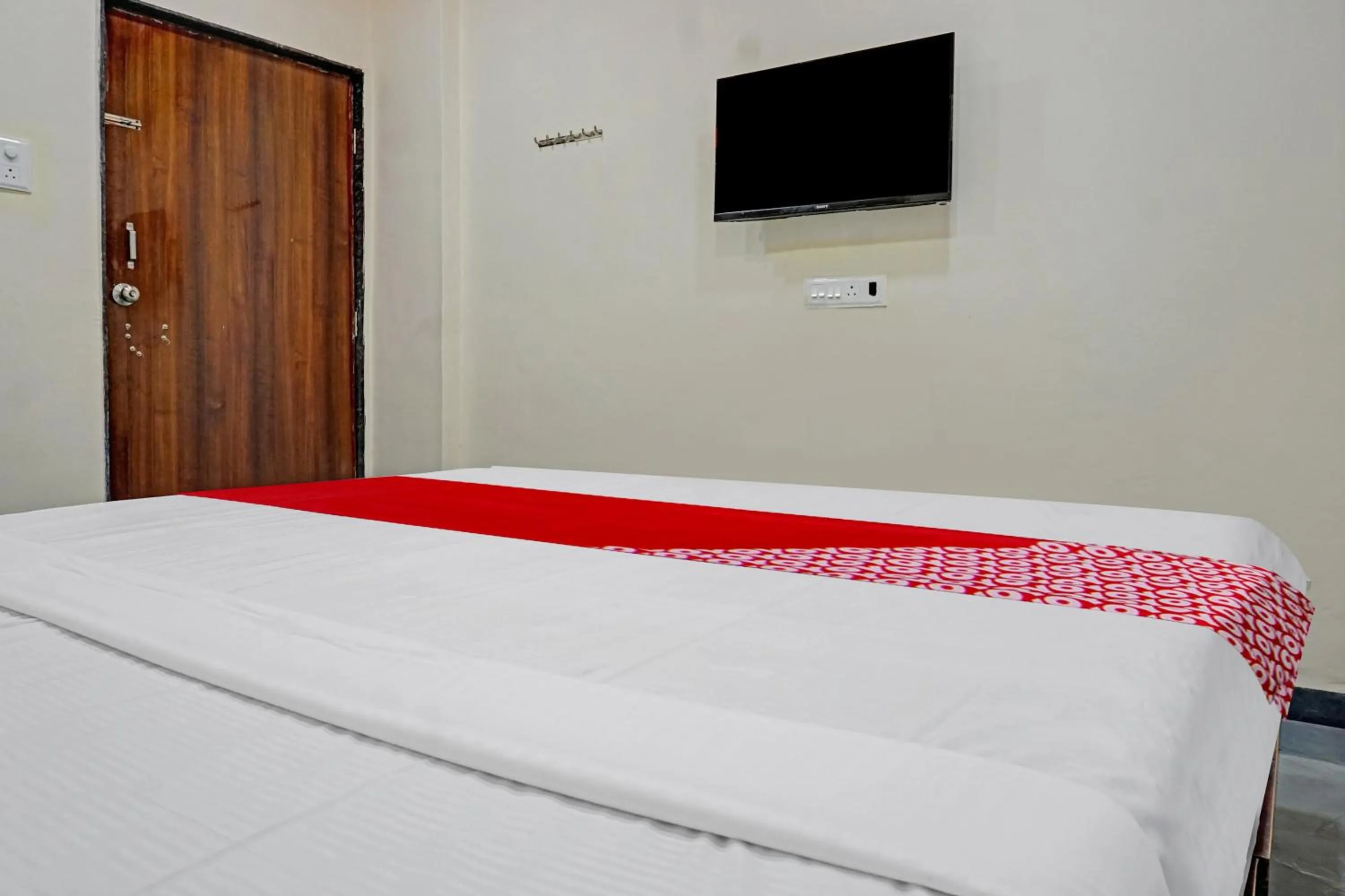 Bedroom in OYO Flagship Sai Balaji Lodge