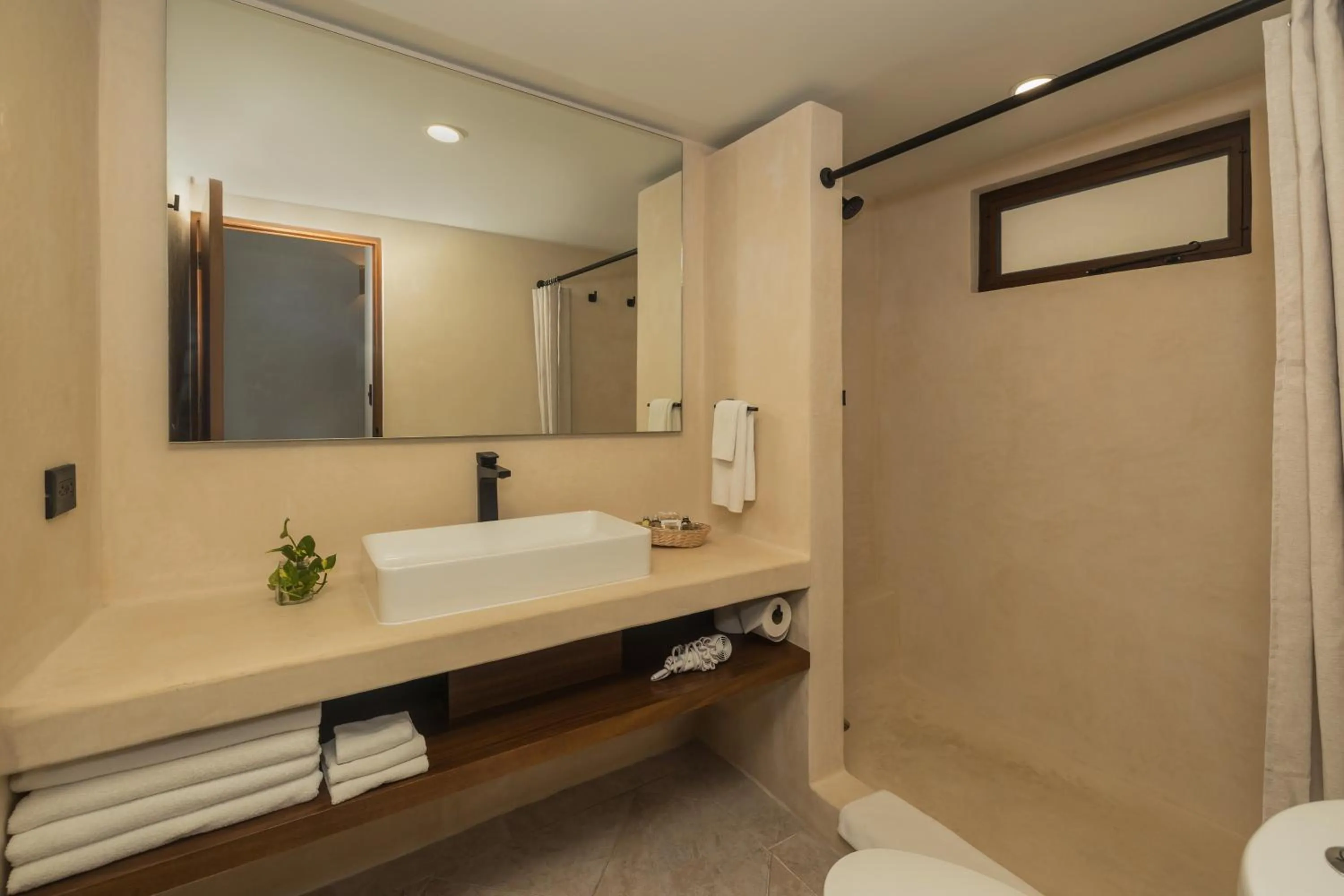 Shower in Casa del Mar Cozumel Hotel & Dive Resort with free access to an exclusive beach club