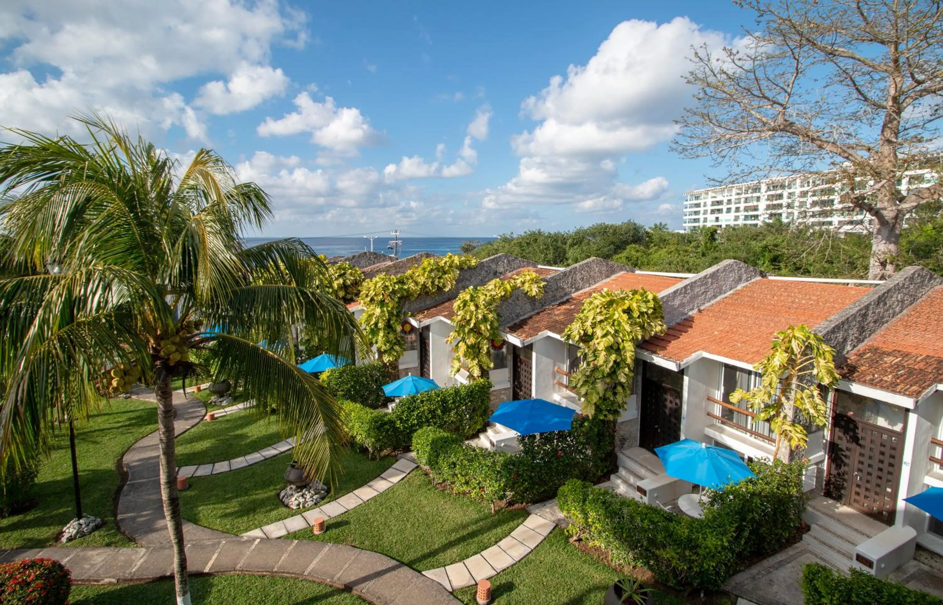 Garden view in Casa del Mar Cozumel Hotel & Dive Resort with free access to an exclusive beach club