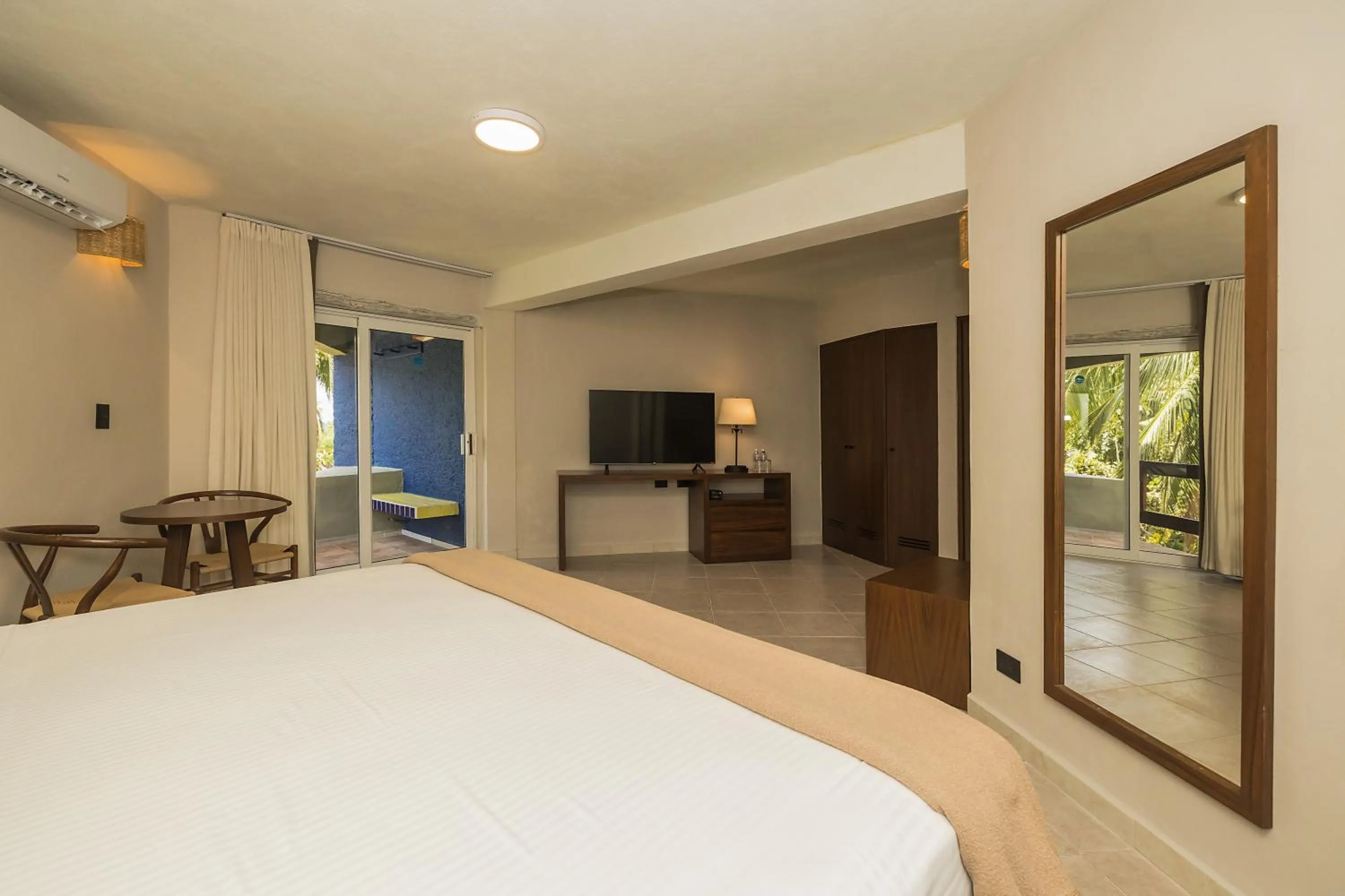 Bed in Casa del Mar Cozumel Hotel & Dive Resort with free access to an exclusive beach club