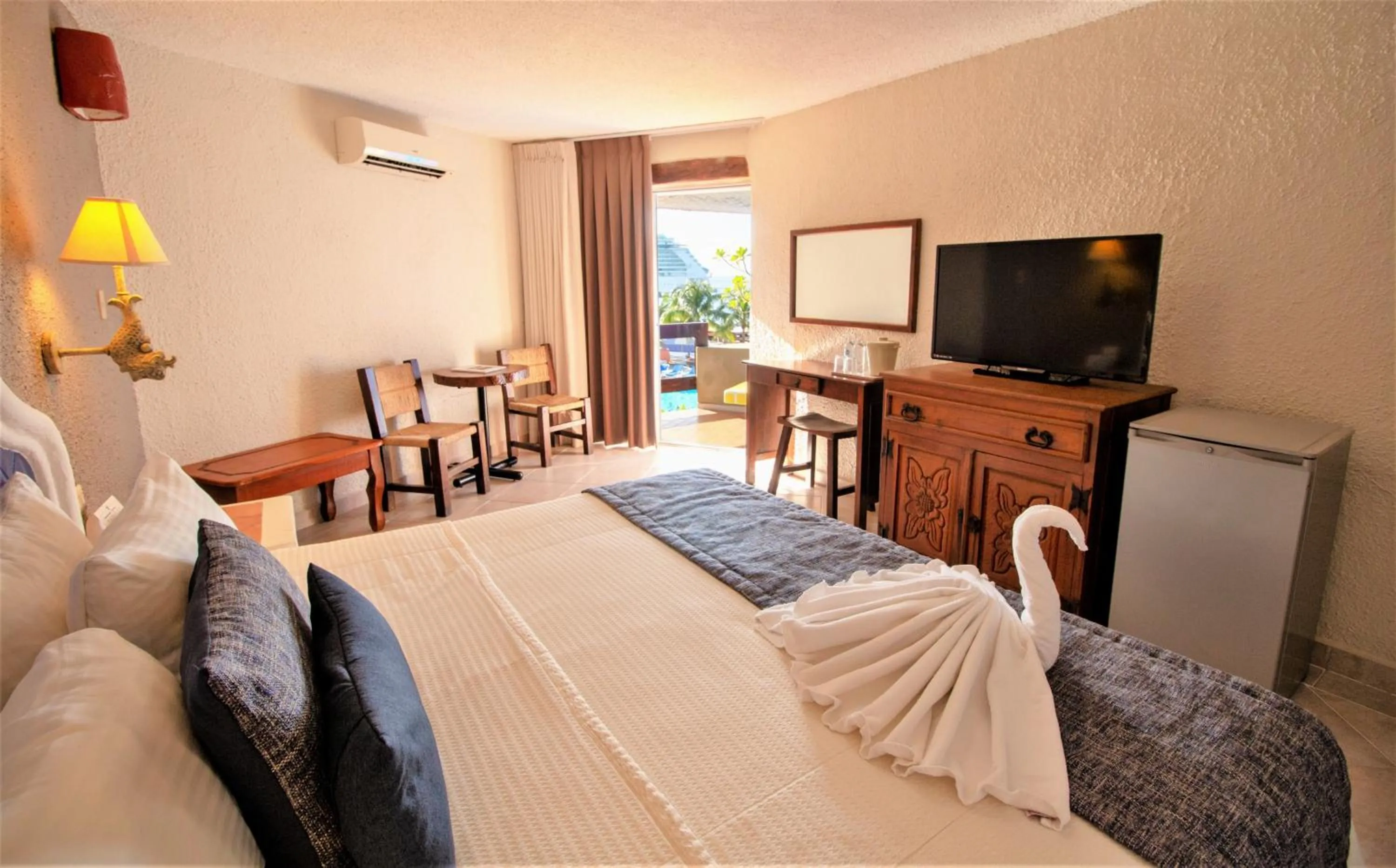 Bedroom, Bed in Casa del Mar Cozumel Hotel & Dive Resort with free access to an exclusive beach club