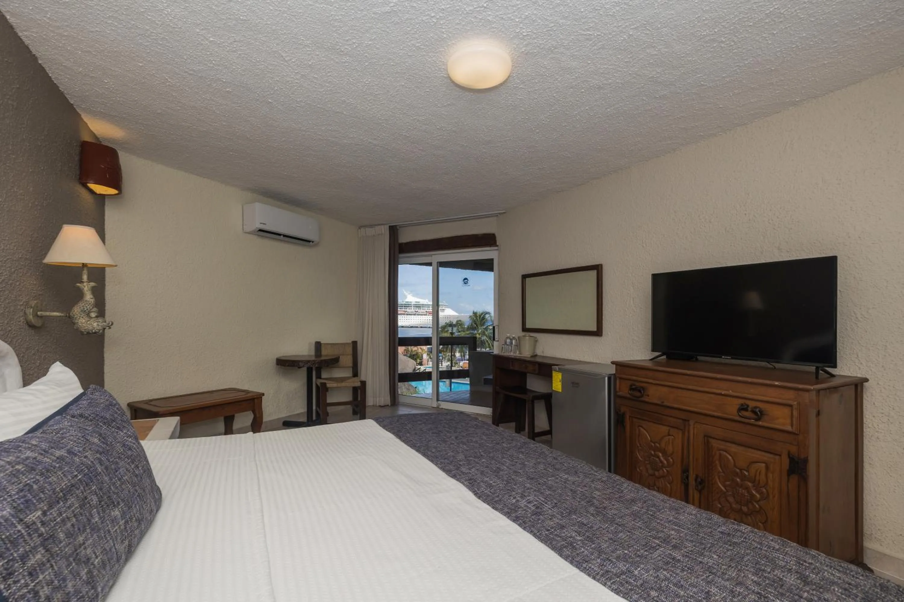 Bedroom, Bed in Casa del Mar Cozumel Hotel & Dive Resort with free access to an exclusive beach club