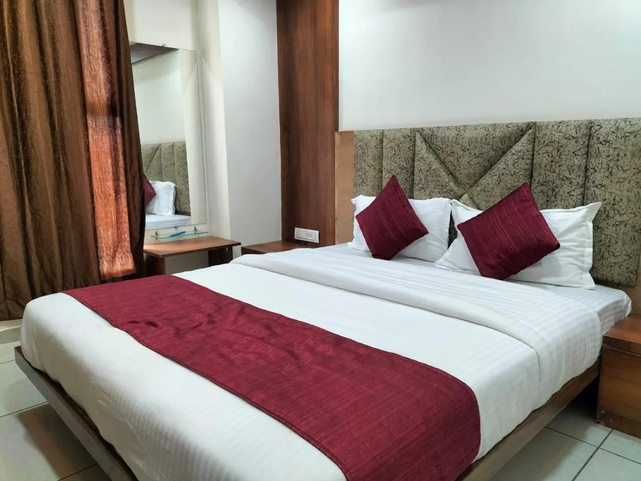 Bed in Hotel Divya Palace