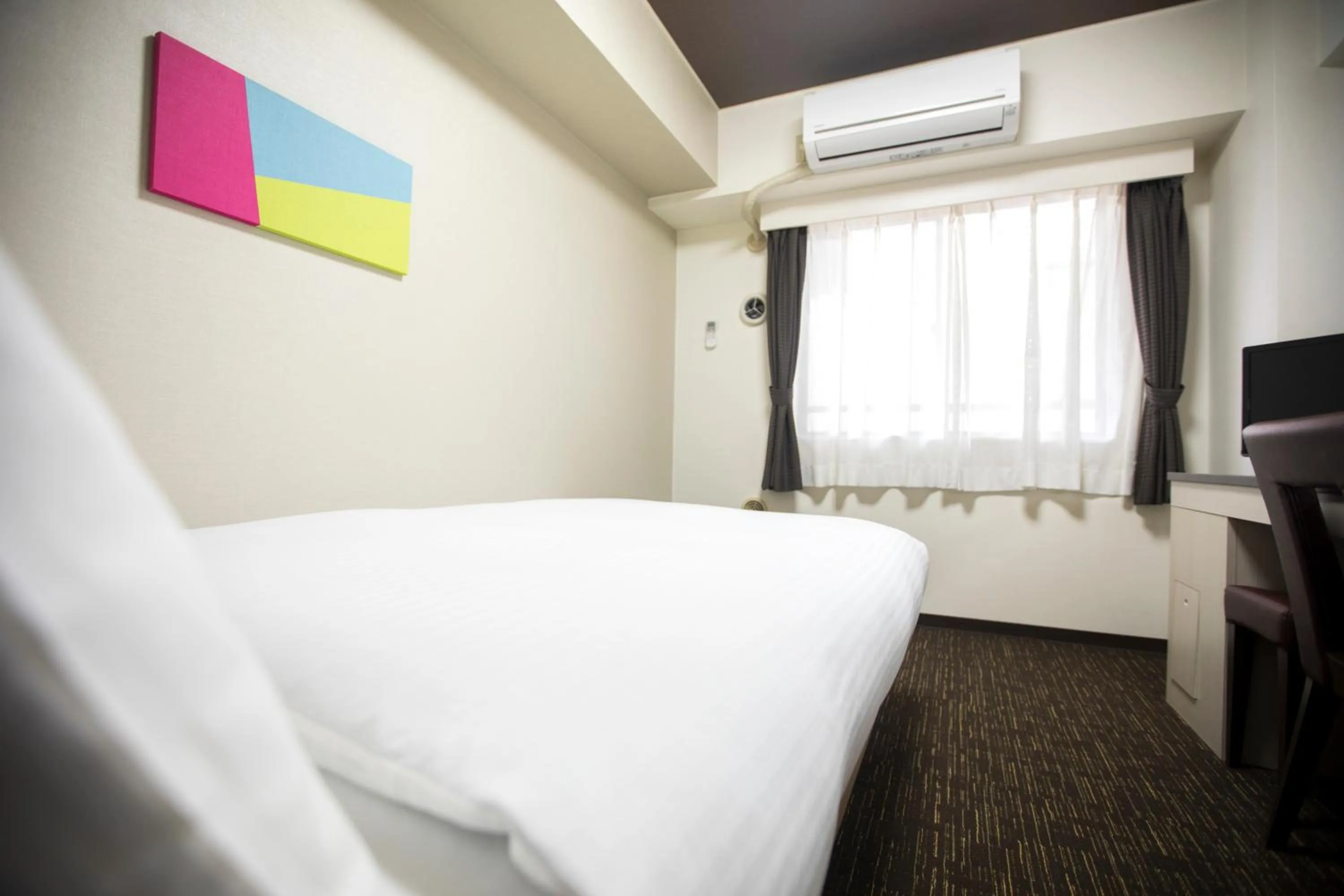 Bed in FLEXSTAY INN Kawasaki Kaizuka