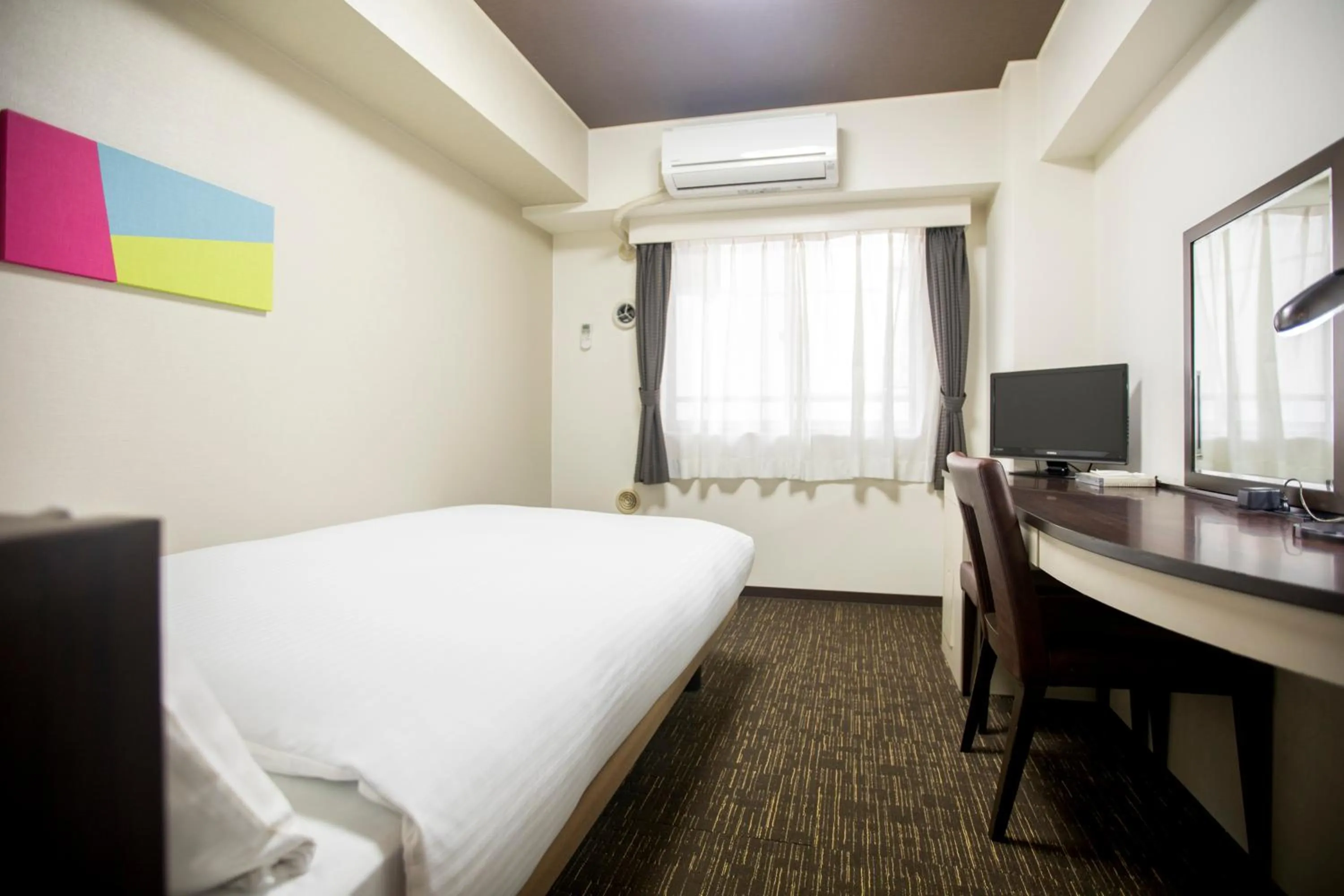 Bed in FLEXSTAY INN Kawasaki Kaizuka