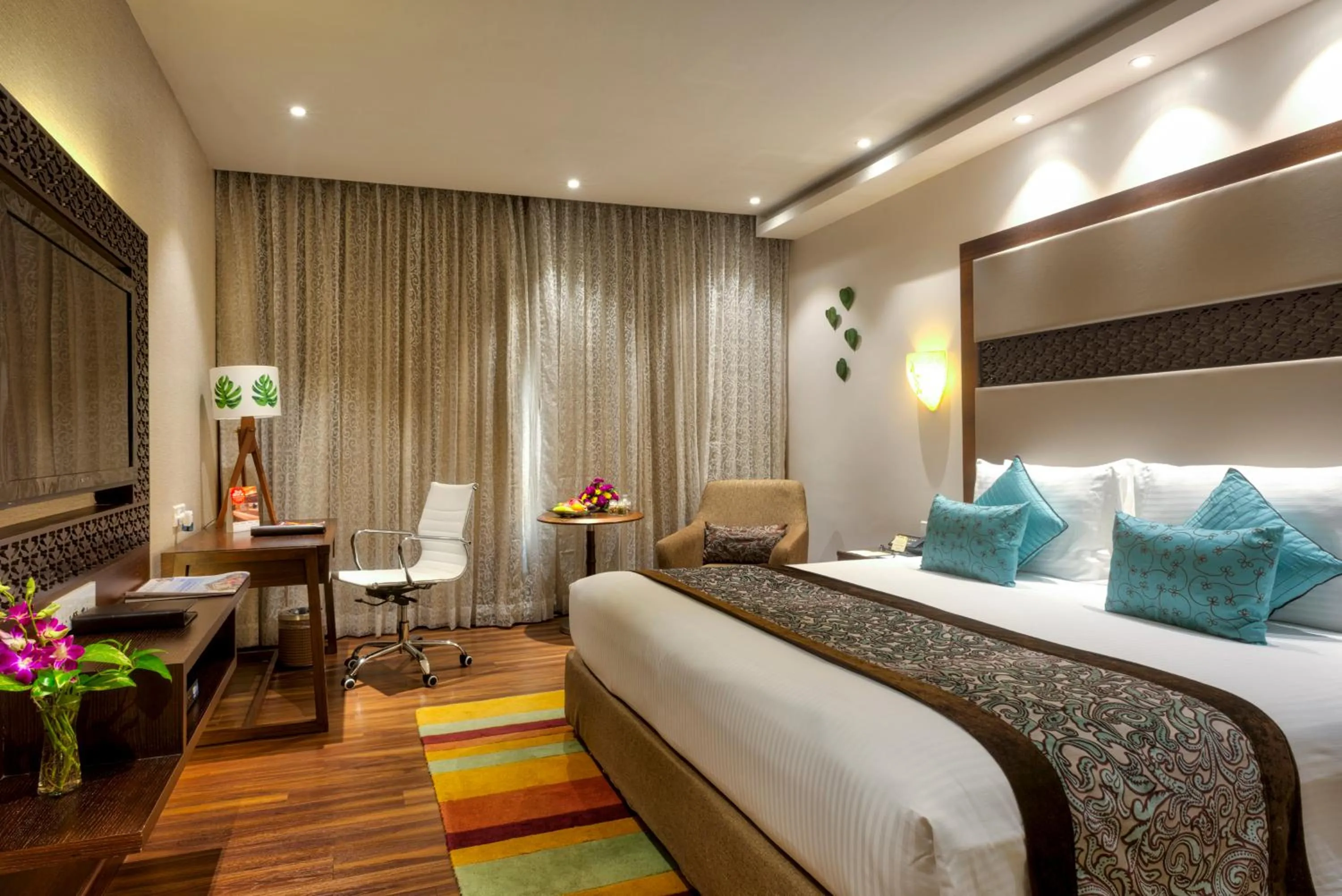 Bed in Grand Chennai by GRT Hotels