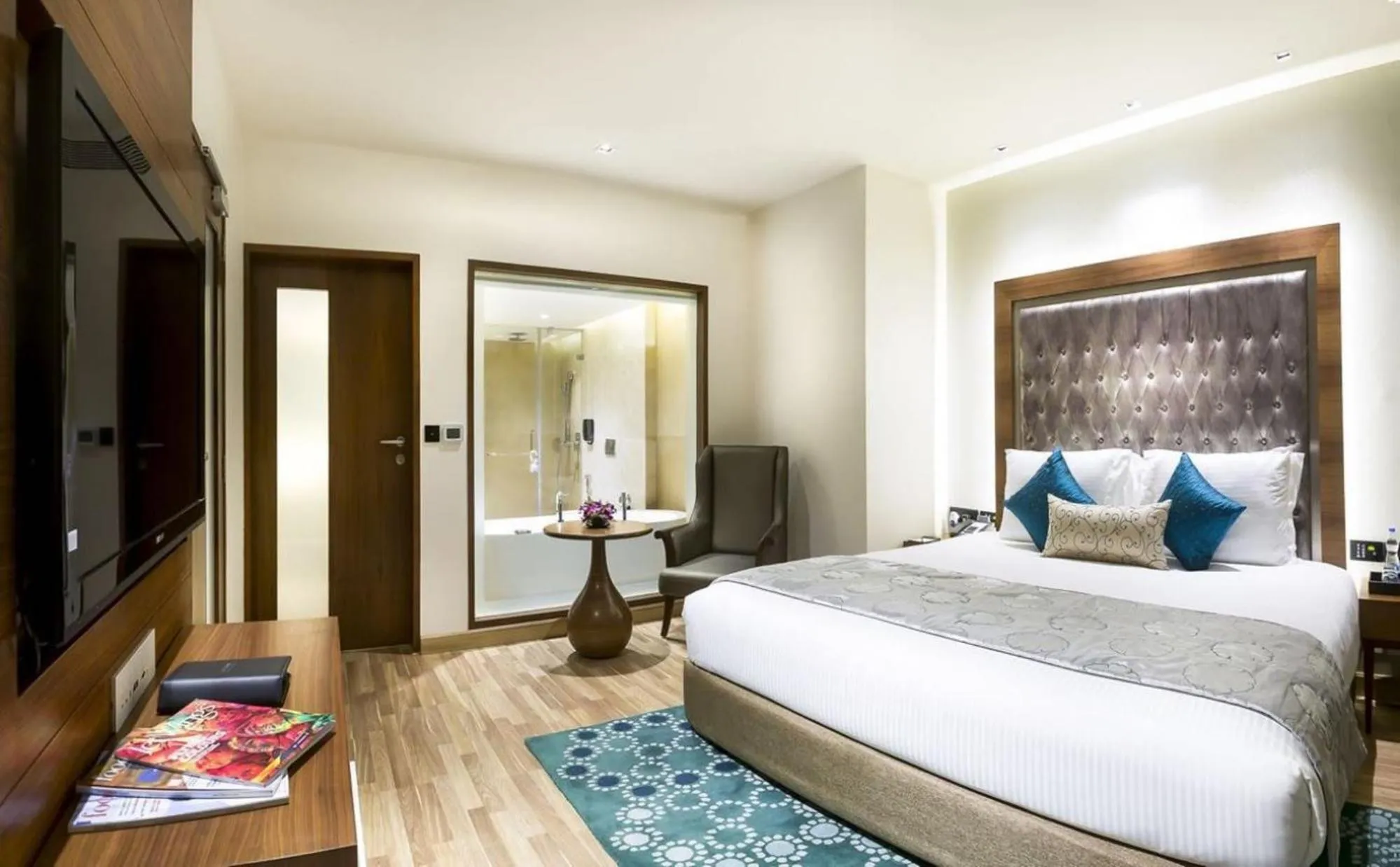 Living room, Bed in Grand Chennai by GRT Hotels