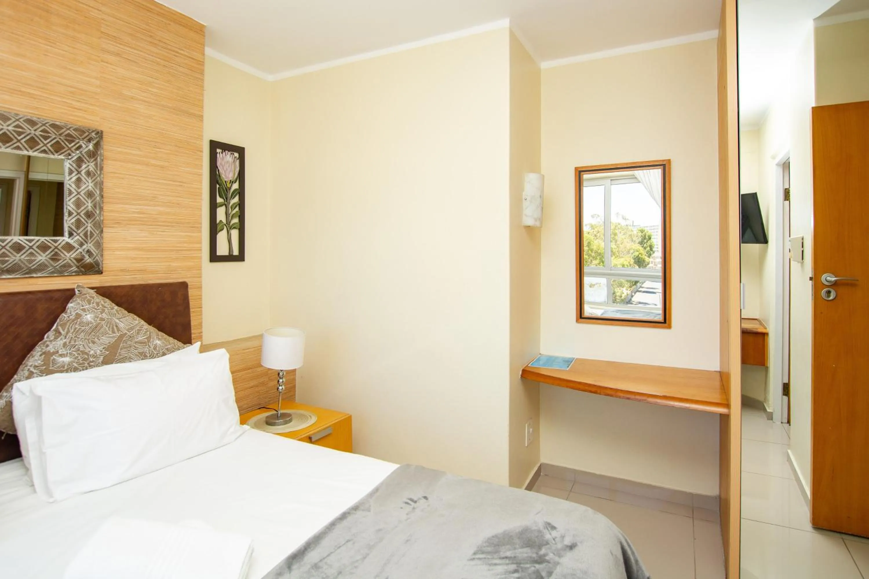 Bed in Ocean Breeze Hotel